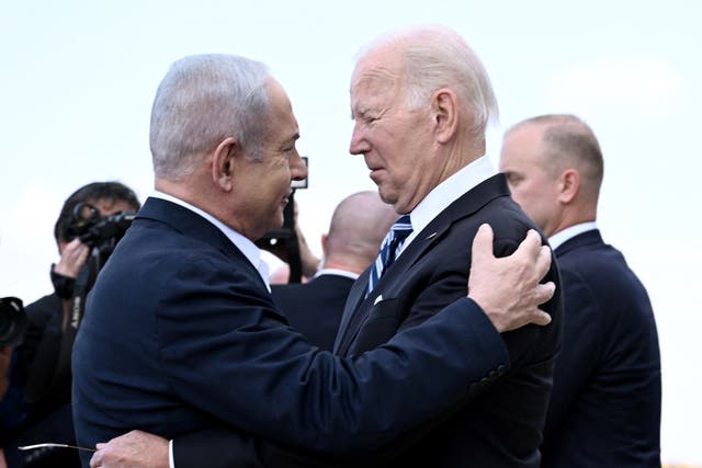 <p>Israel Prime Minister Benjamin Netanyahu greets US President Joe Biden upon his arrival at Tel Aviv's Ben Gurion airport on 18 October 2023</p>