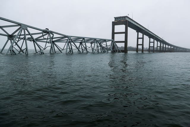 <p>Part of the collapsed Francis Scott Key Bridge stand on 3 April 2024, in Baltimore, Maryland </p>