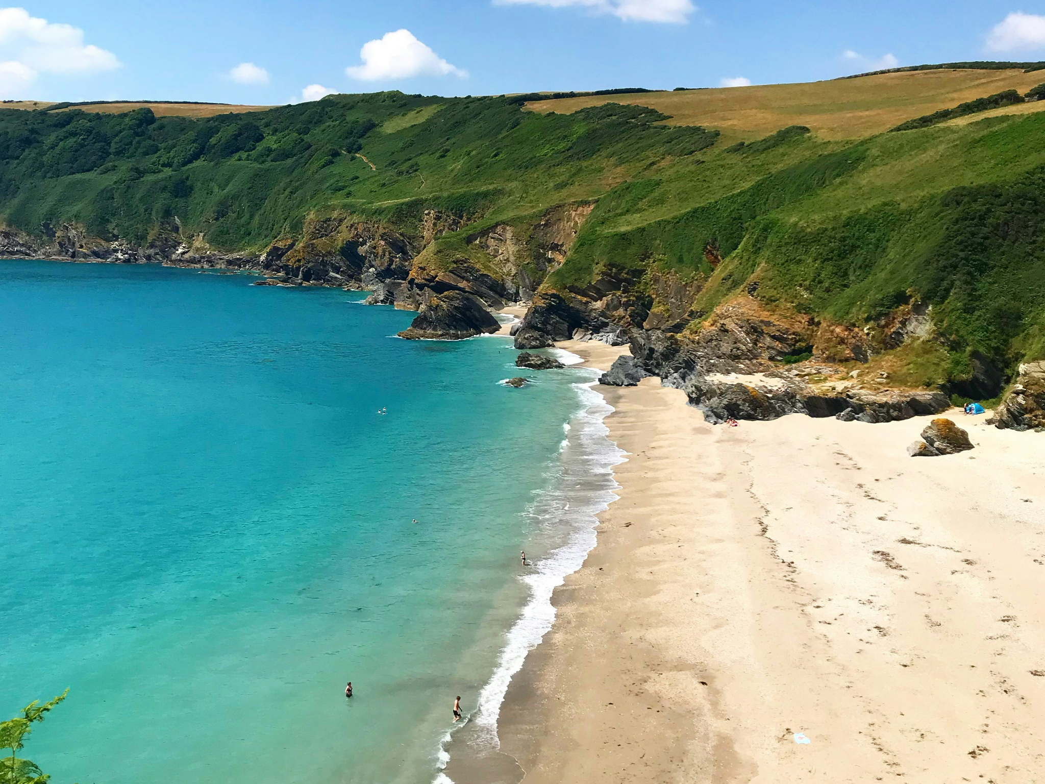 Discover hidden coastal spots, such as secluded Lantic Bay, Cornwall