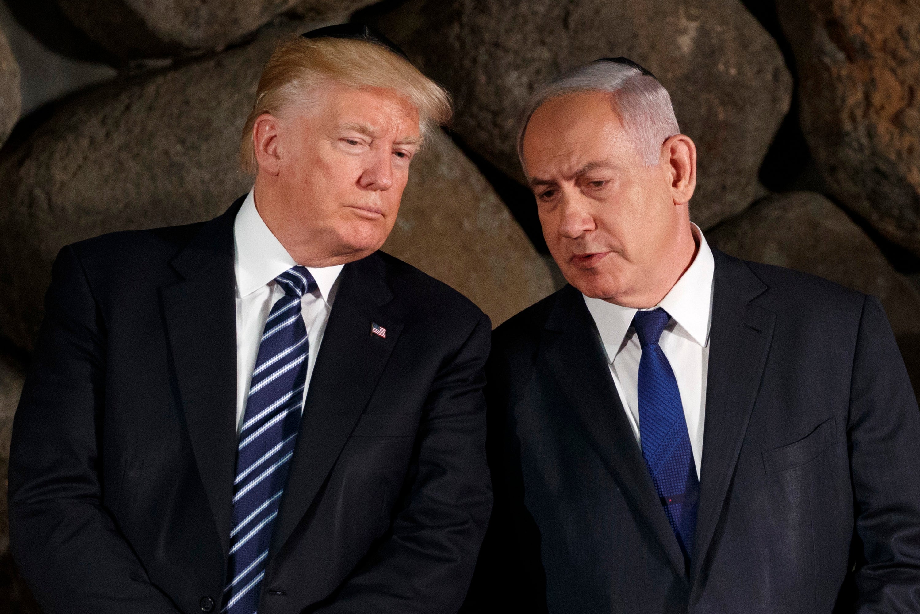 Donald Trump talks with Benjamin Netanyahu during a ceremony in Jerusalem, May 2017
