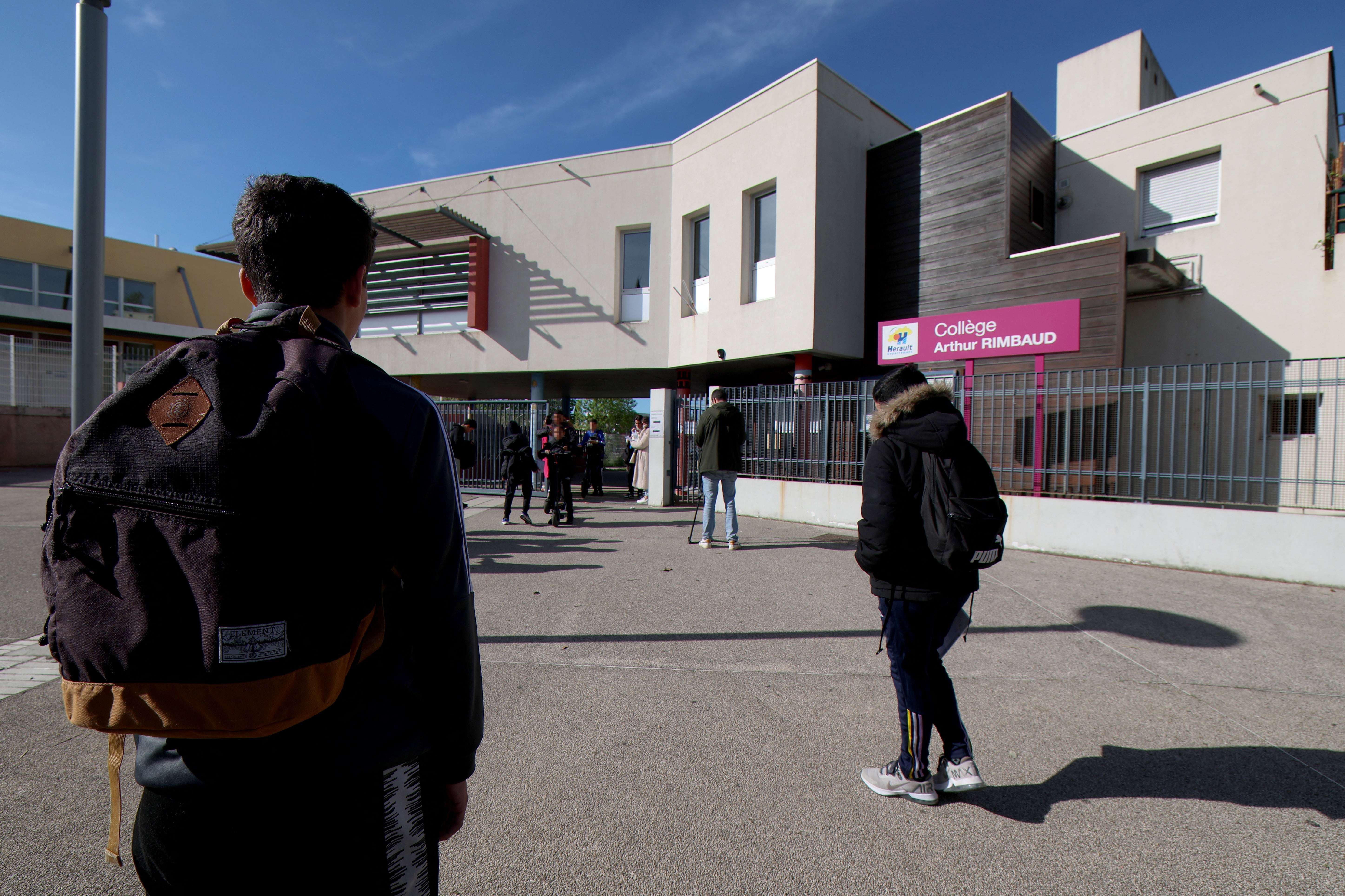 Students arrive on 4 April 2024 in Montpellier, southern France, at the College Arthur-Rimbaud secondary school a day after a 14-year-old girl was assaulted outside the school