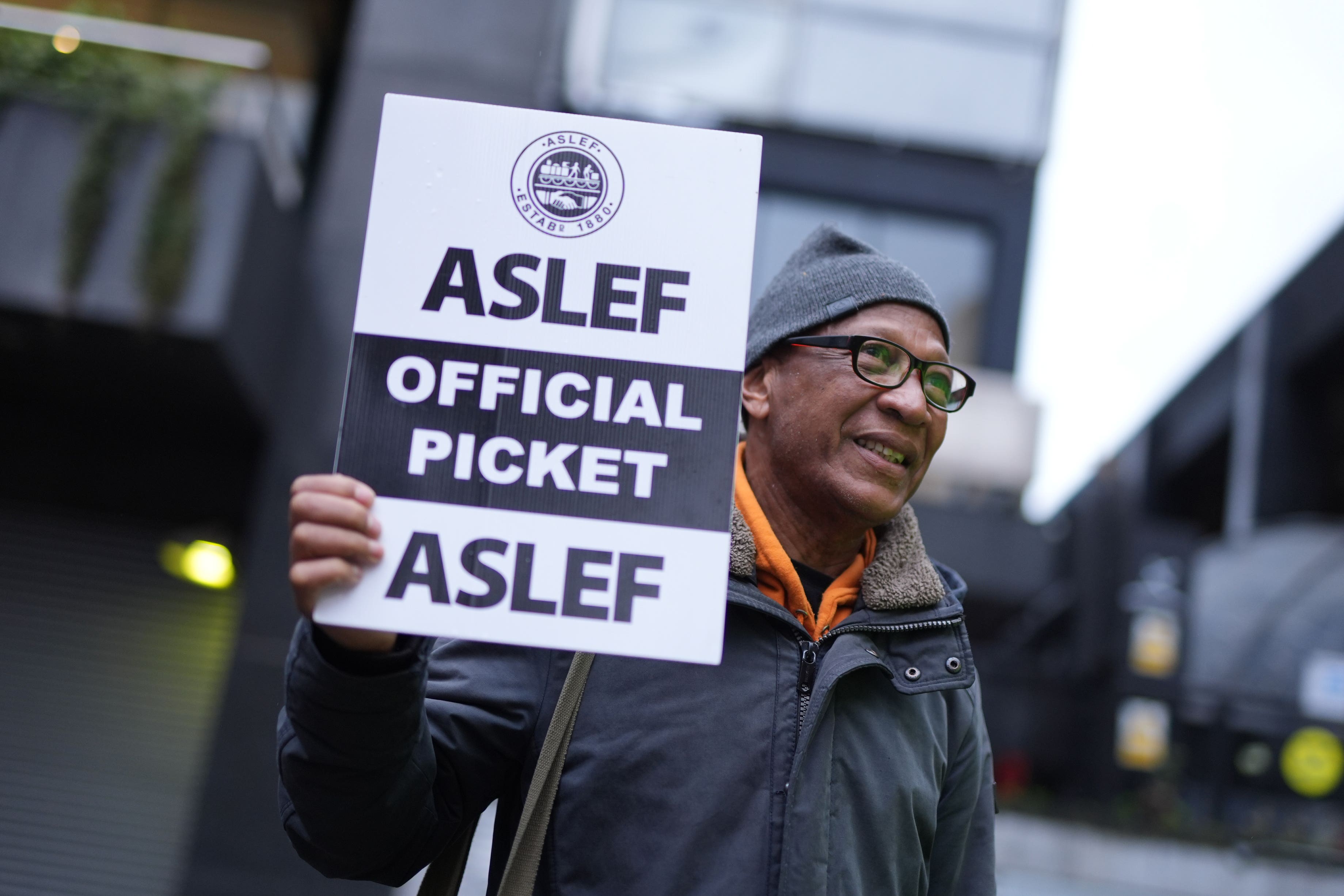Train drivers from the Aslef union on the picket line at Euston station in London (Jordan Pettitt/PA)