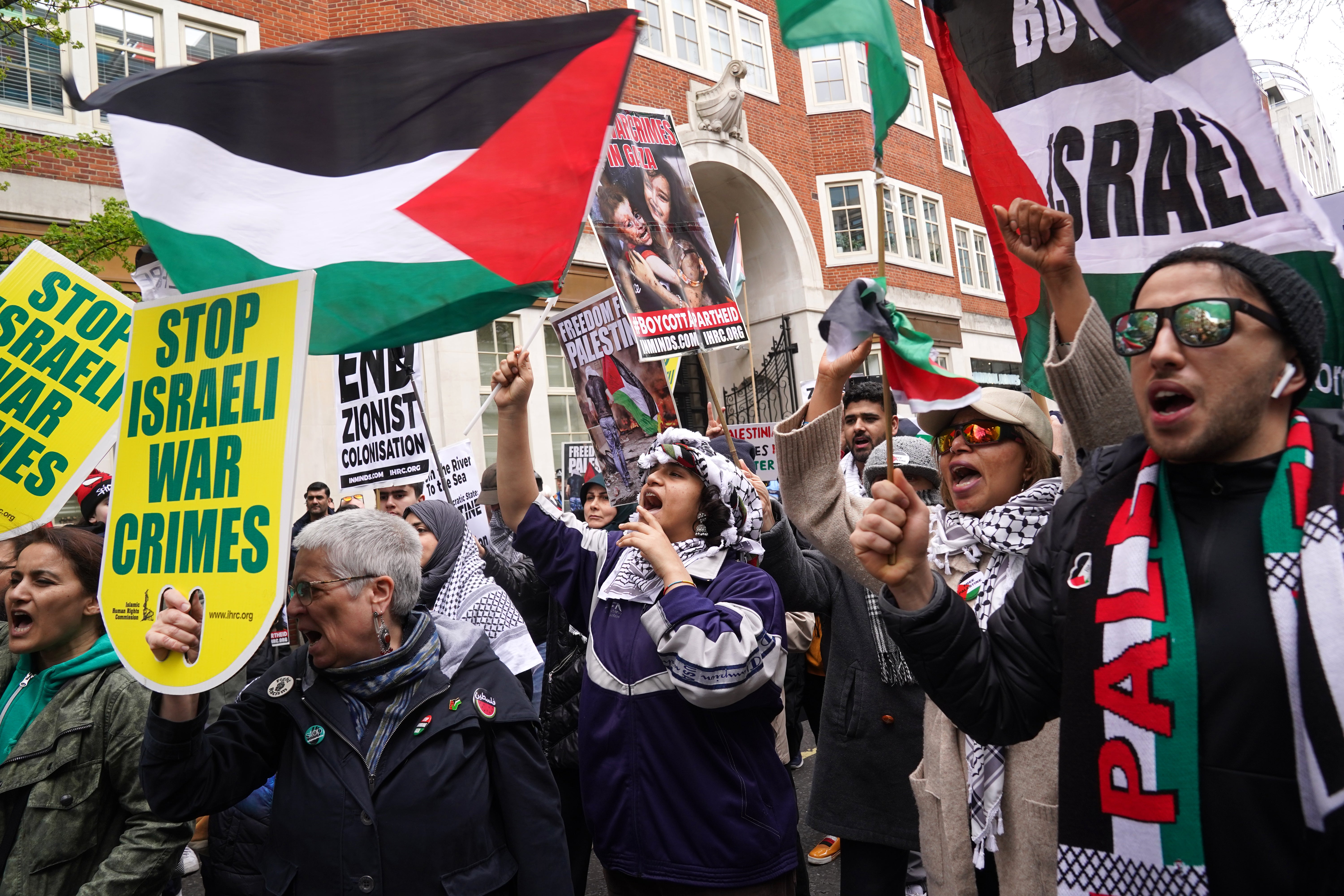 Demonstrators take part in the annual Al Quds day march in support of Palestine in London on Friday