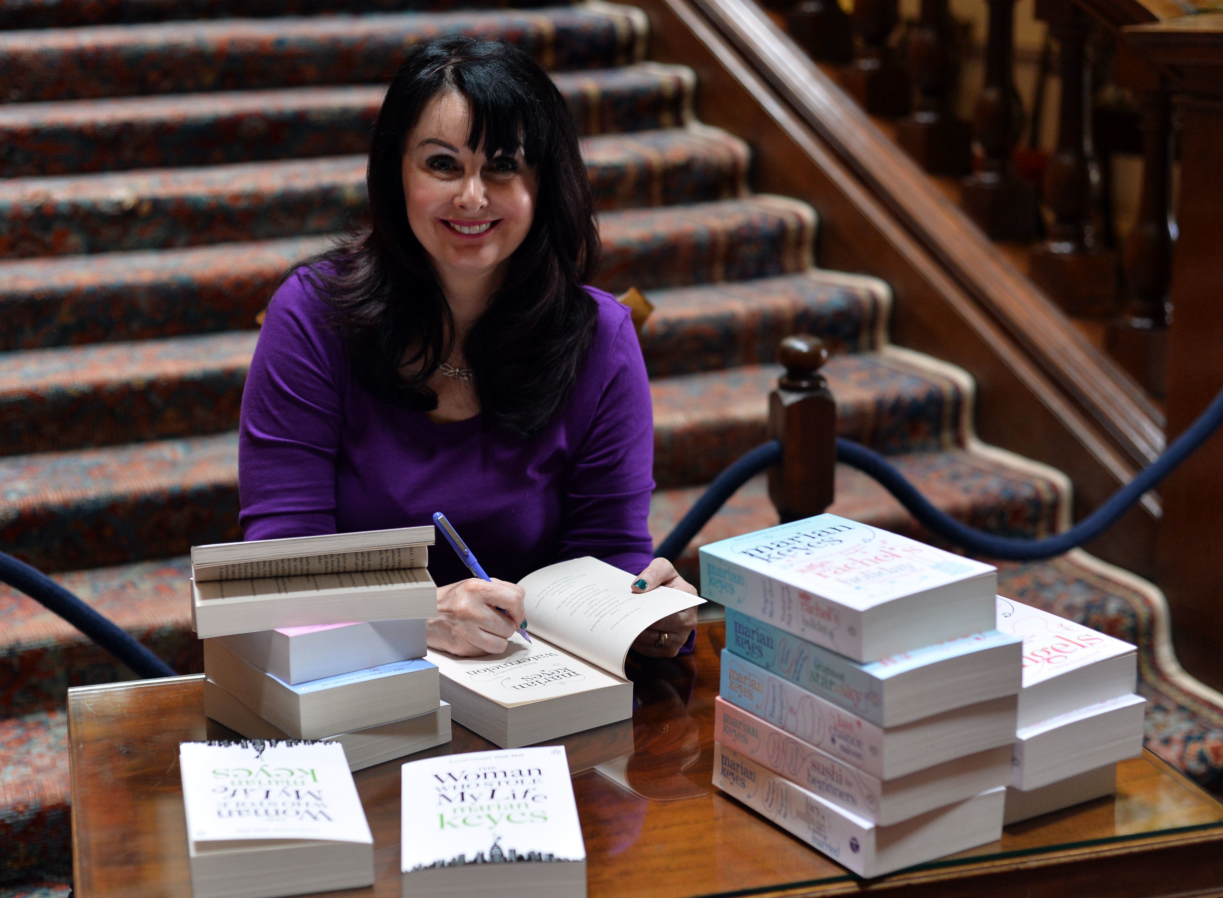 Keyes signs copies of her books at the Althorp Literary Festival, 2015