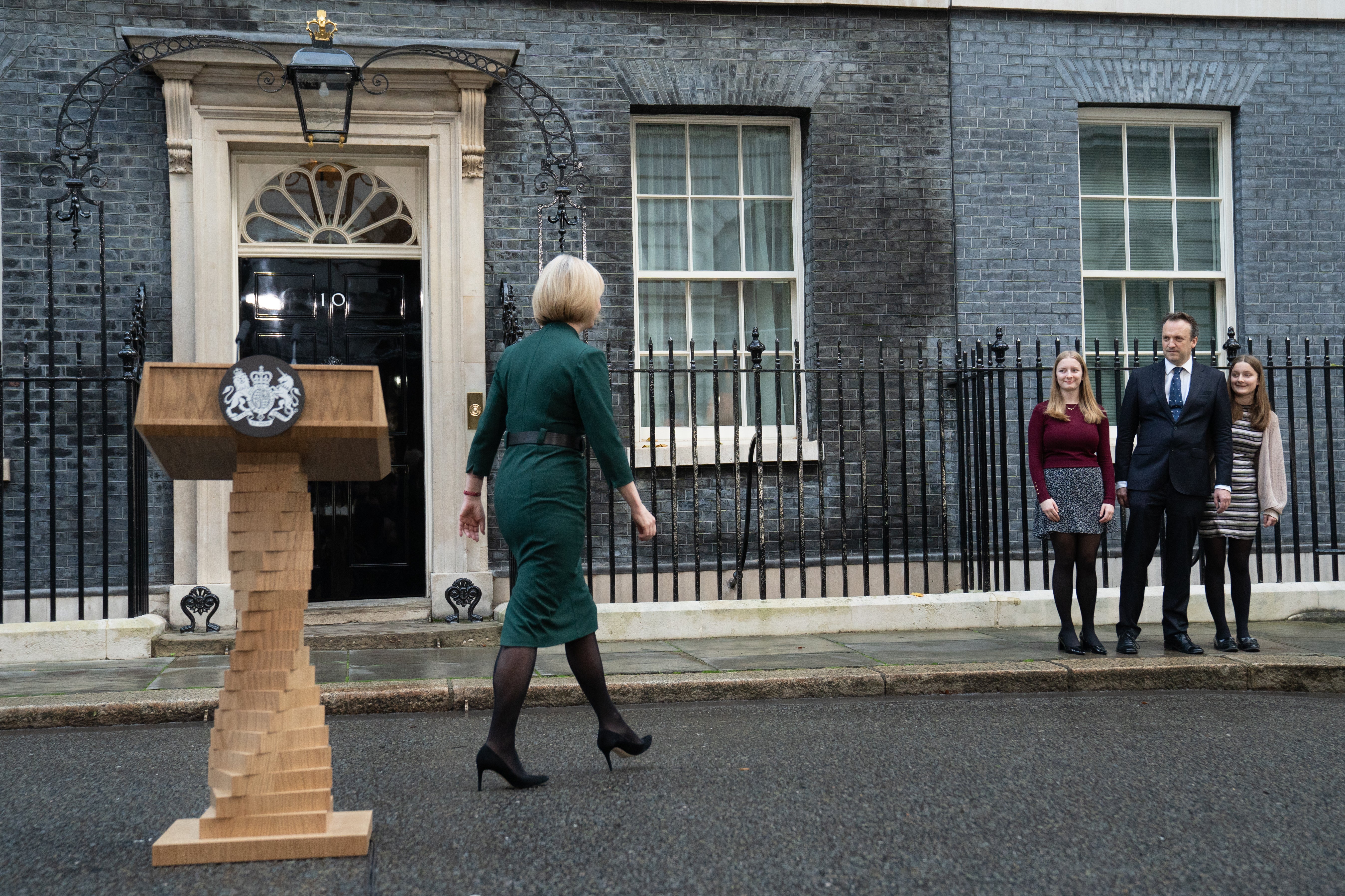 Outgoing prime minister Liz Truss joins her family after addressing the media outside 10 Downing Street, and saying she would resigining as PM