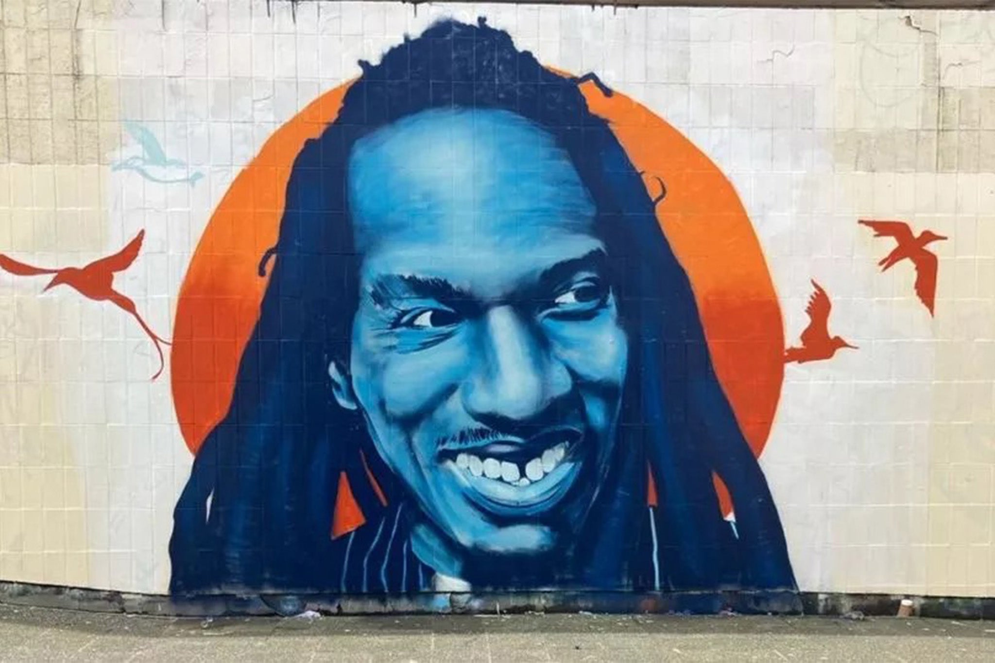 The colourful mural of poet and activist Benjamin Zephaniah, before it disappeared under a layer of beige paint