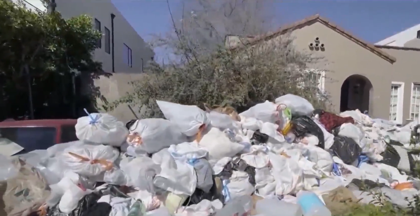 <p>Sanitation workers removed the piles of debris</p>
