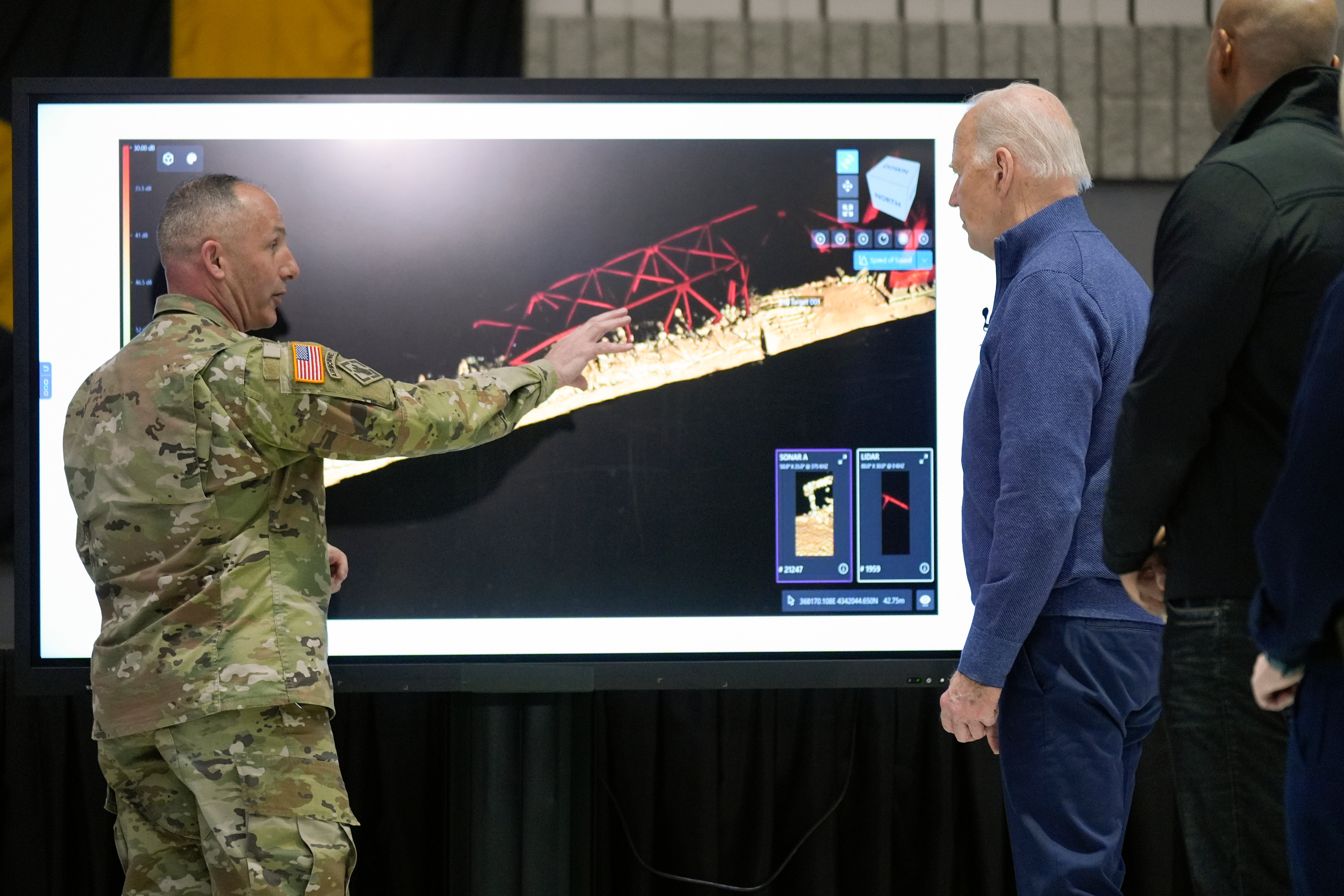 President Joe Biden participates in an operational briefing on the response and recovery efforts of the collapsed Francis Scott Key Bridge, Friday, April 5, 2024 in Dundalk, Md., as Maryland Gov. Wes Moore, right, looks on.