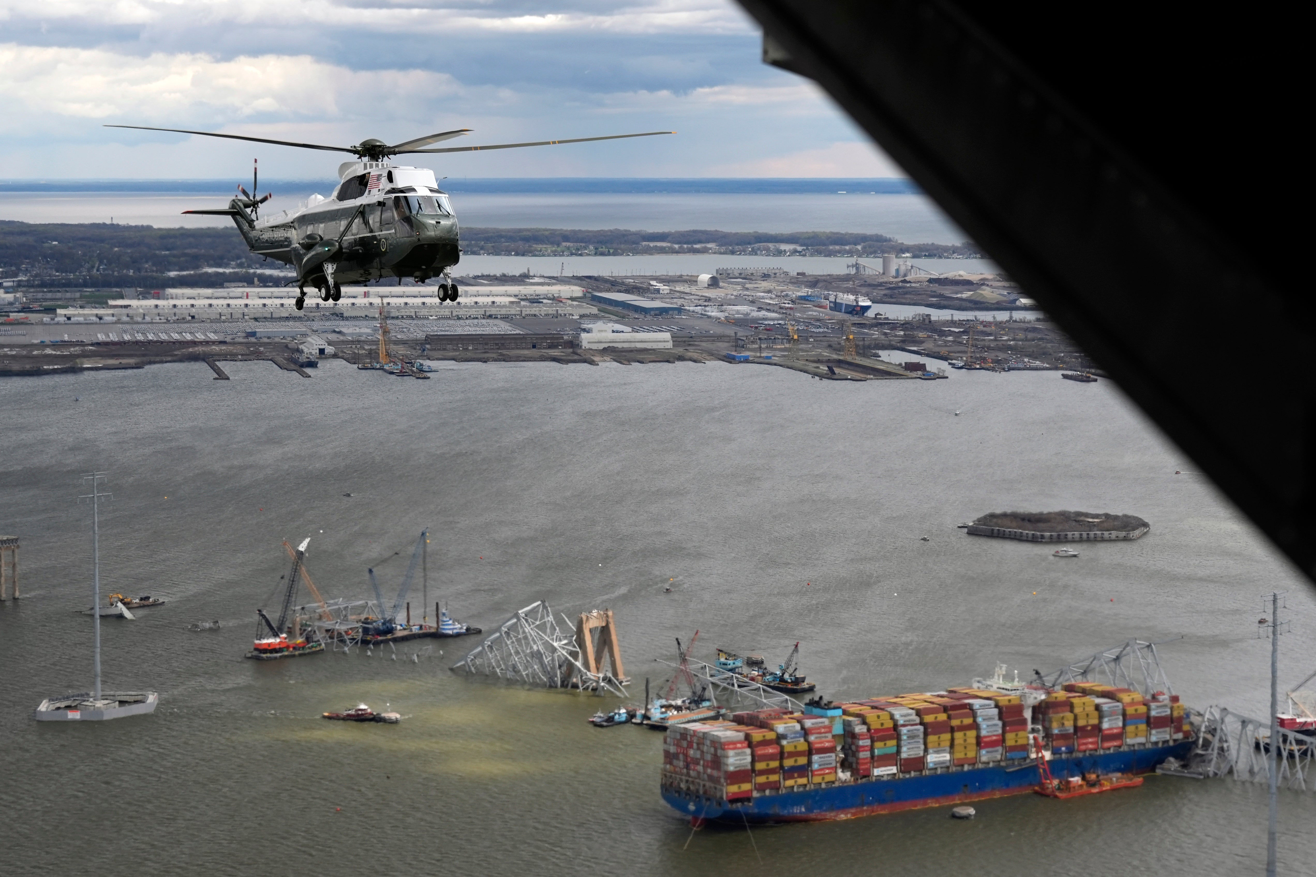 President Joe Biden, aboard Marine One, takes an aerial tour of the collapsed Francis Scott Key Bridge in Baltimore, Friday, April 5, 2024, as seen from an accompanying aircraft.