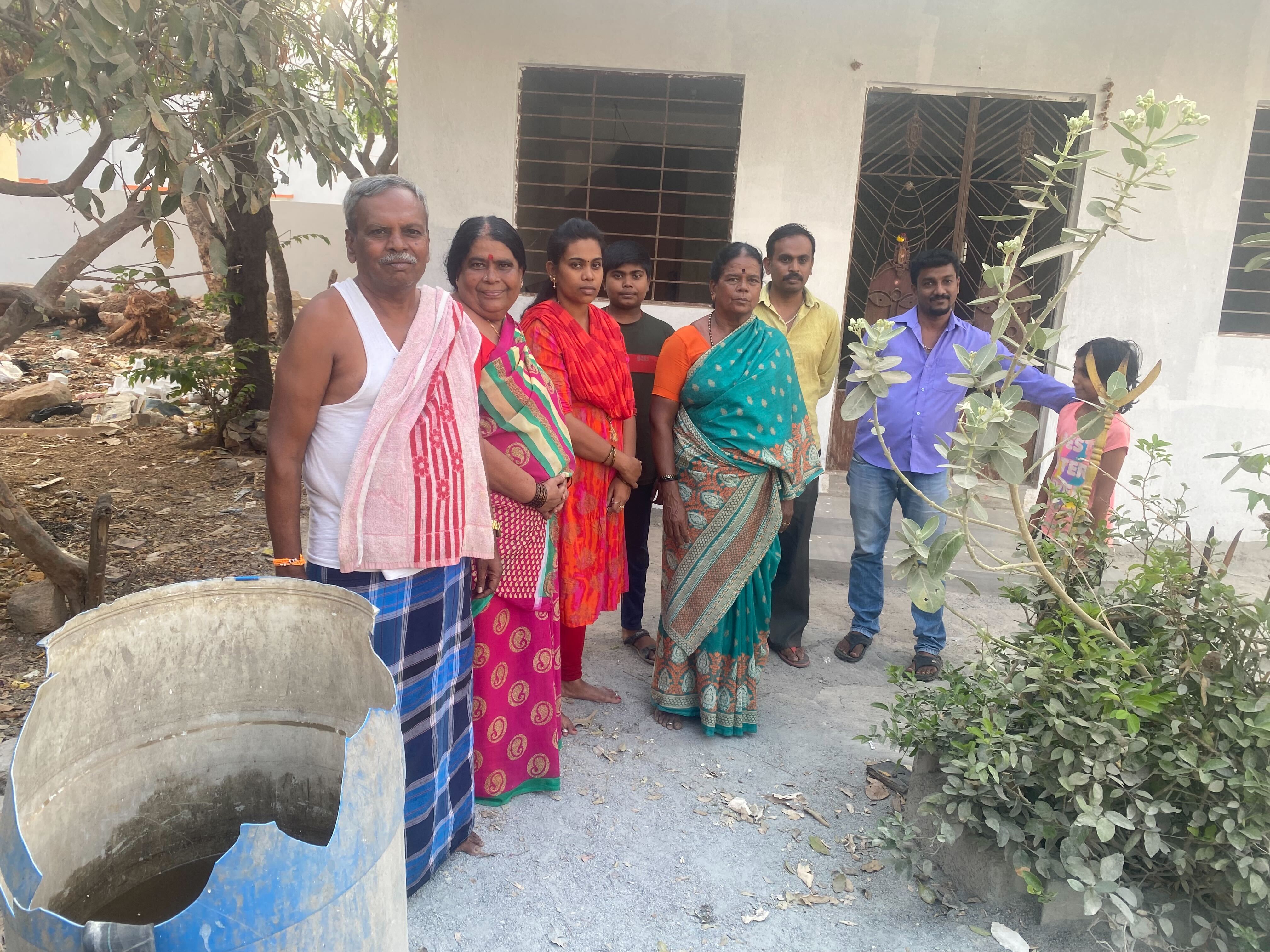 Ramaswamy, his wife and neighbours use a plastic drum to collect water