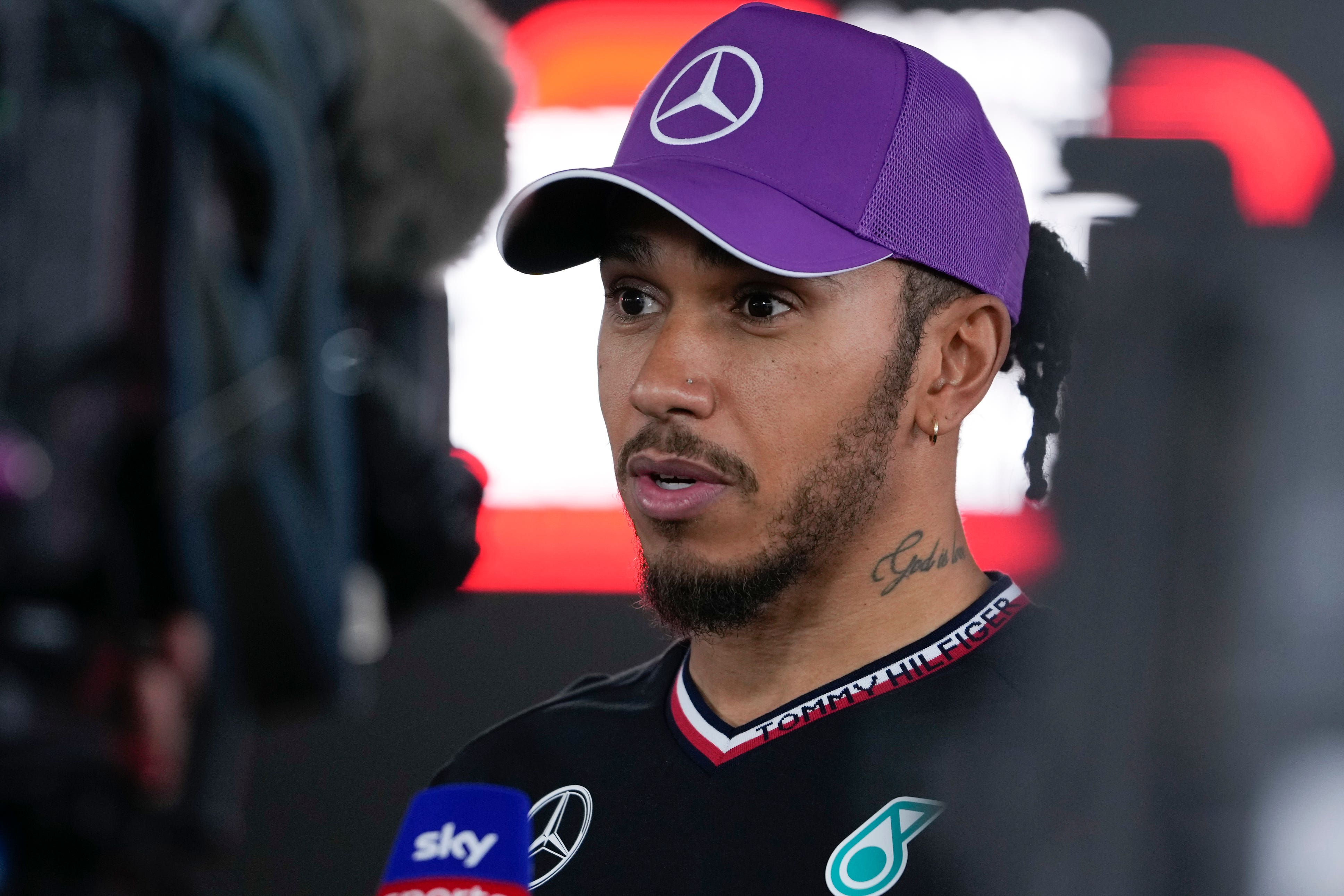Mercedes driver Lewis Hamilton talks to reporters after qualifying in Japan
