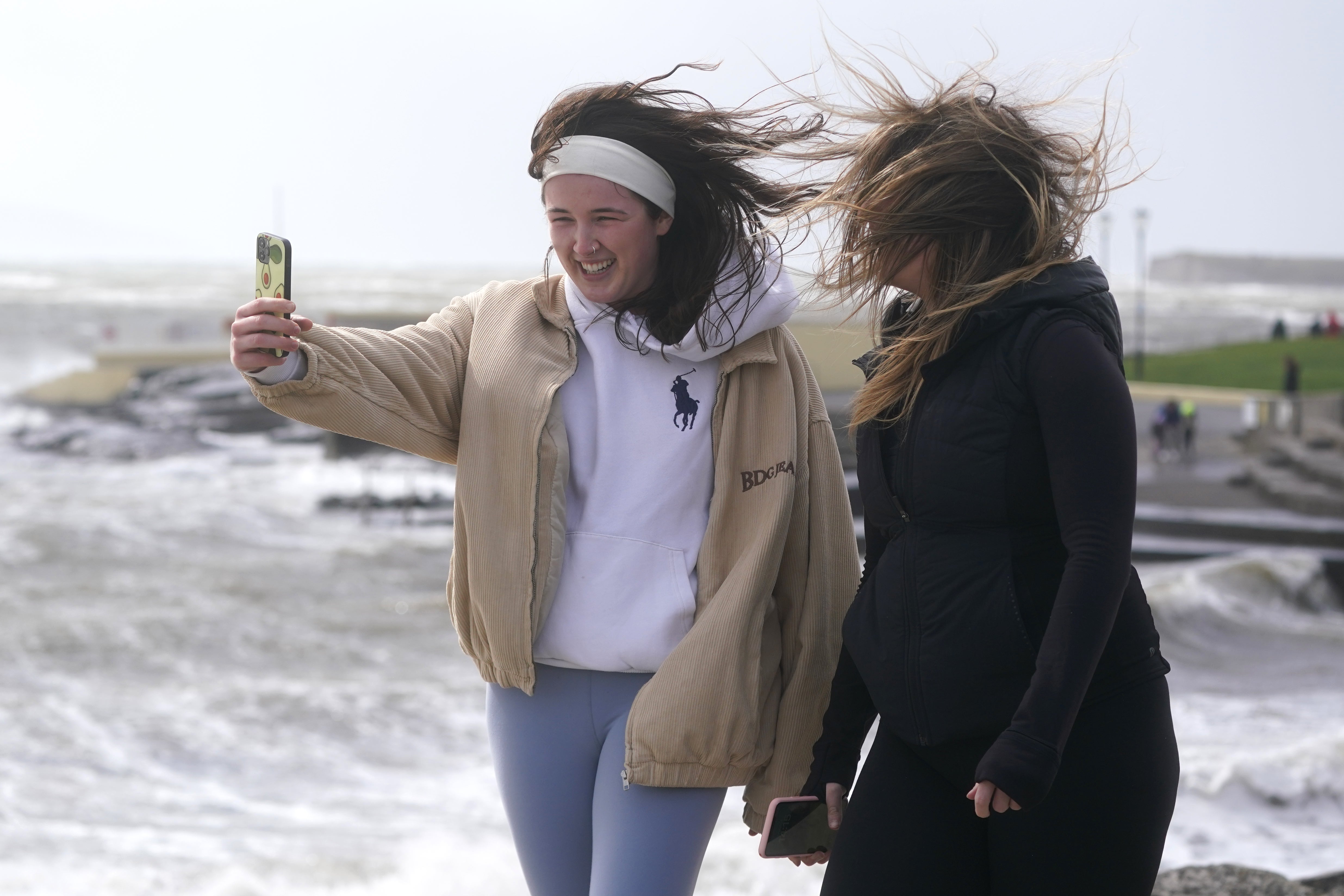 People take a selfie as Storm Kathleen hits the coast