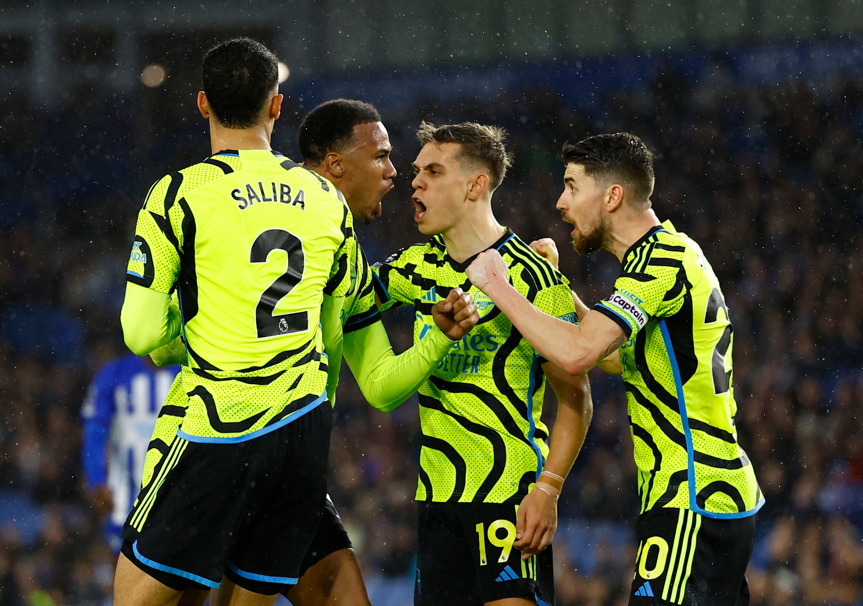 Gabriel Magalhaes (second left) celebrates after blocking a Brighton shot in the 90th minute