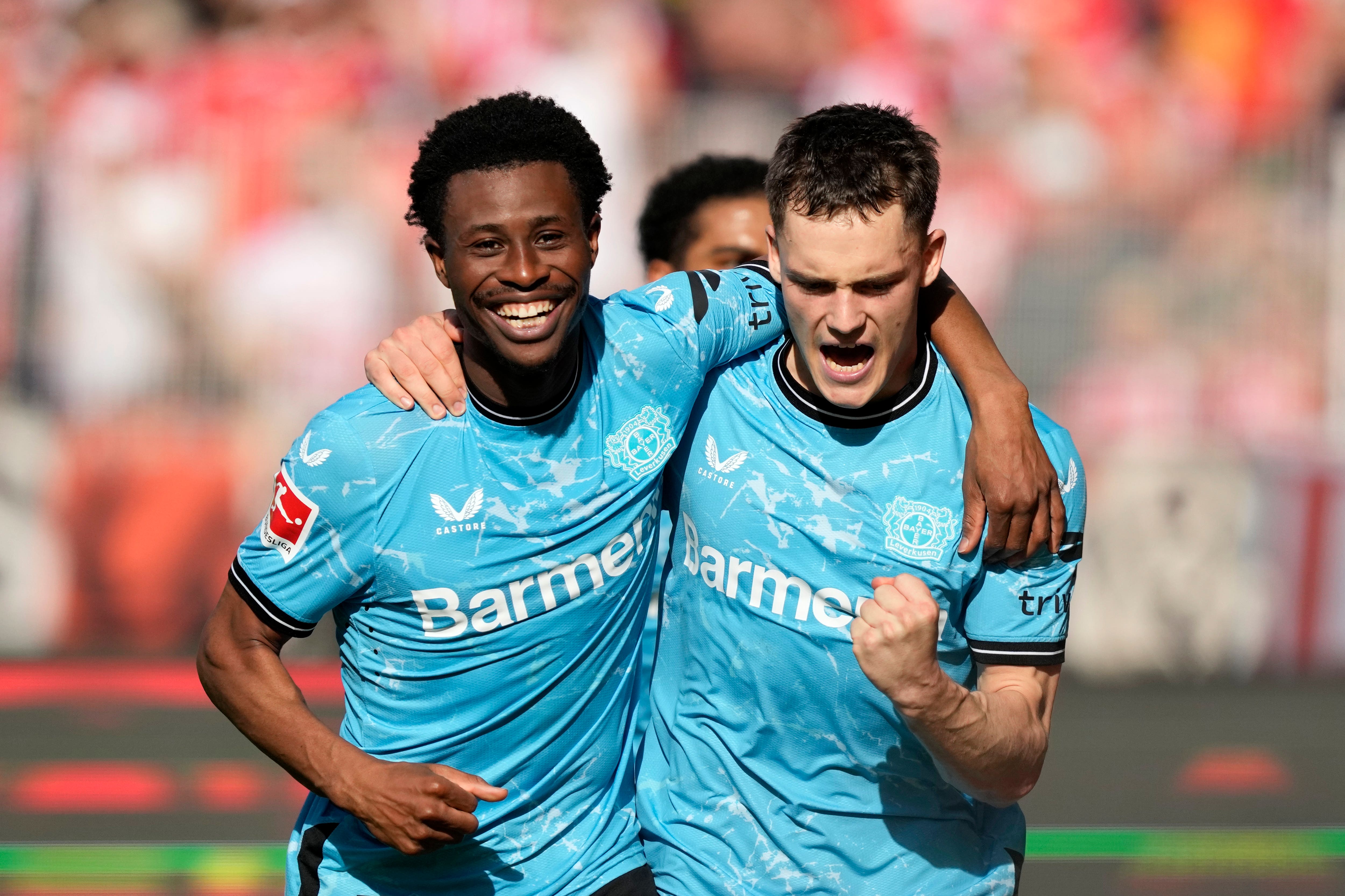 Florian Wirtz, right, fired Bayer Leverkusen to victory over Union Berlin (Ebrahim Noroozi/AP)