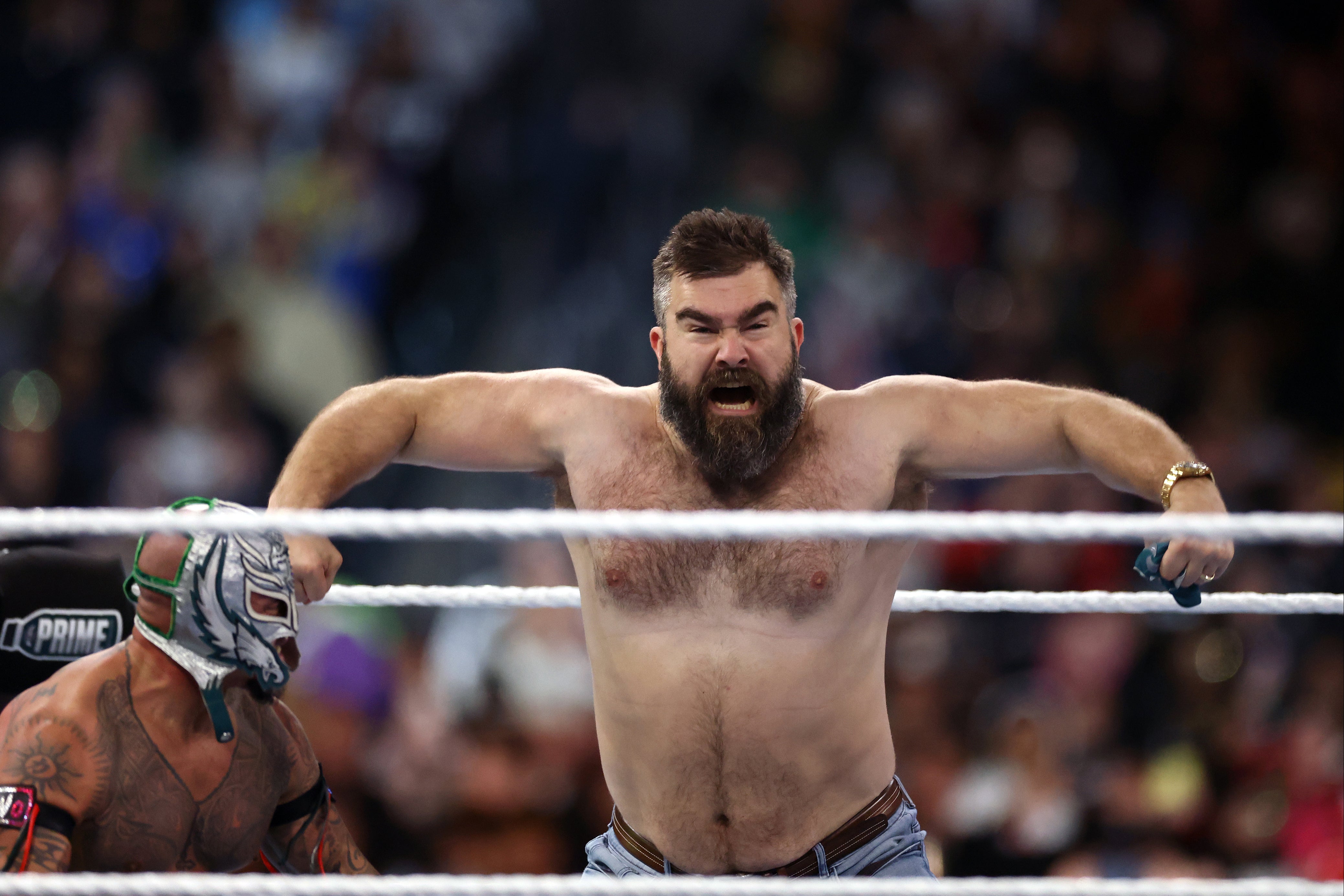 Retired NFL star Jason Kelce (right) with Rey Mysterio at WrestleMania