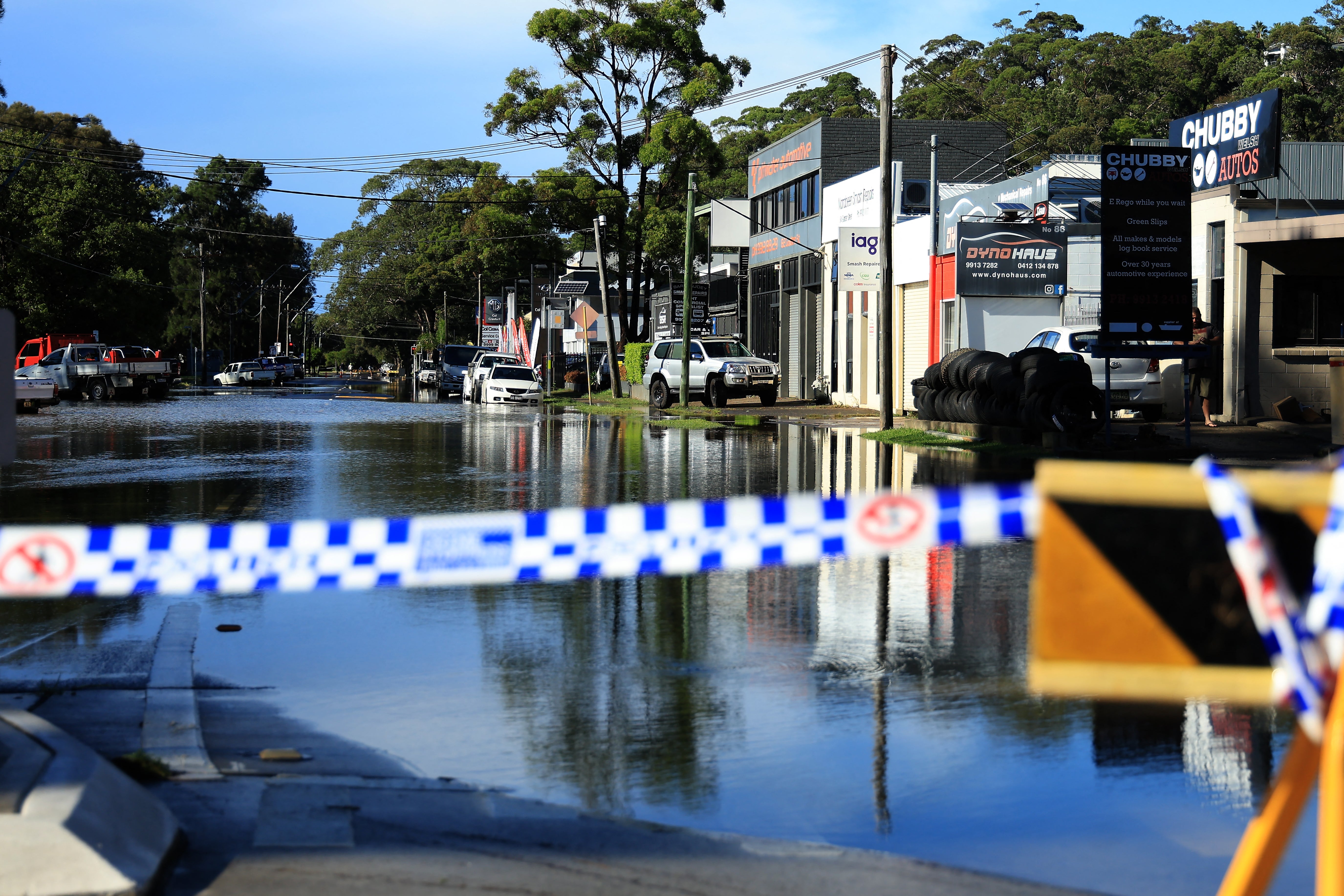 A flooded road is seen in the Sydney suburb of North Narrabeen on 6 April 2024, after heavy rain hit New South Wales state
