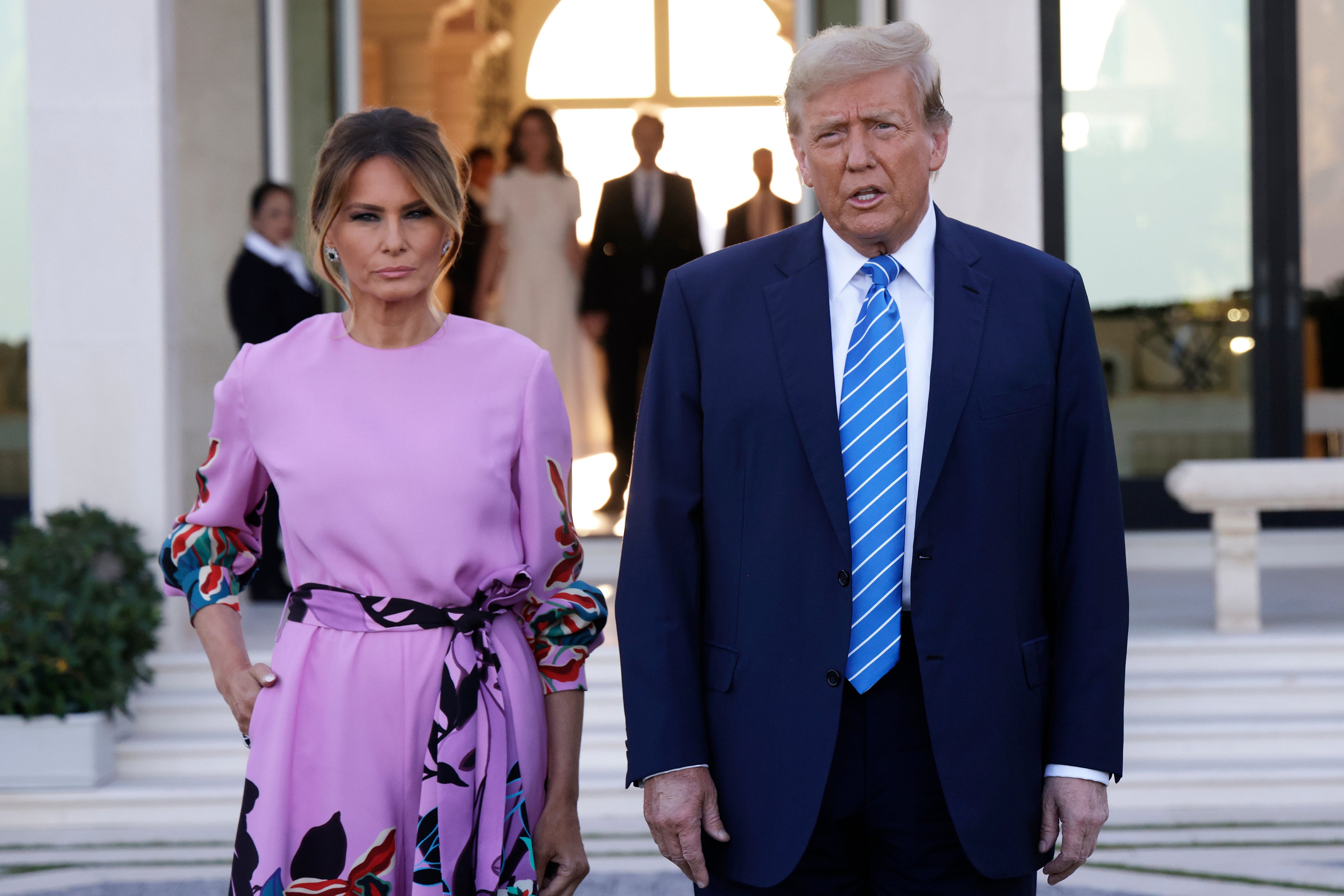 Republican presidential candidate, former US President Donald Trump, arrives at the home of billionaire investor John Paulson, with former first lady Melania Trump, on April 6, 2024 in Palm Beach, Florida