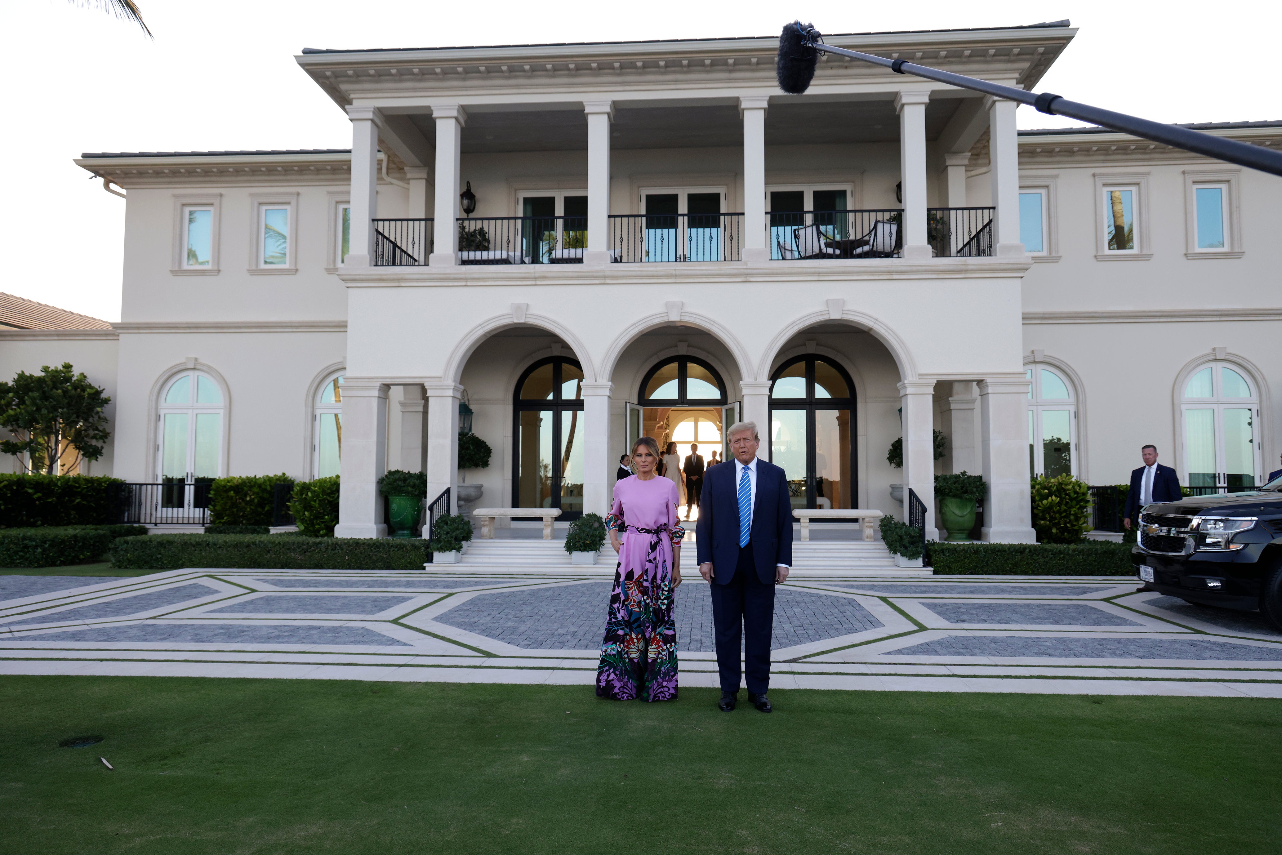 Donald and Melania Trump pictured on Saturday at the home of hedgefund manager John Paulson in Palm Beach during a fundraiser