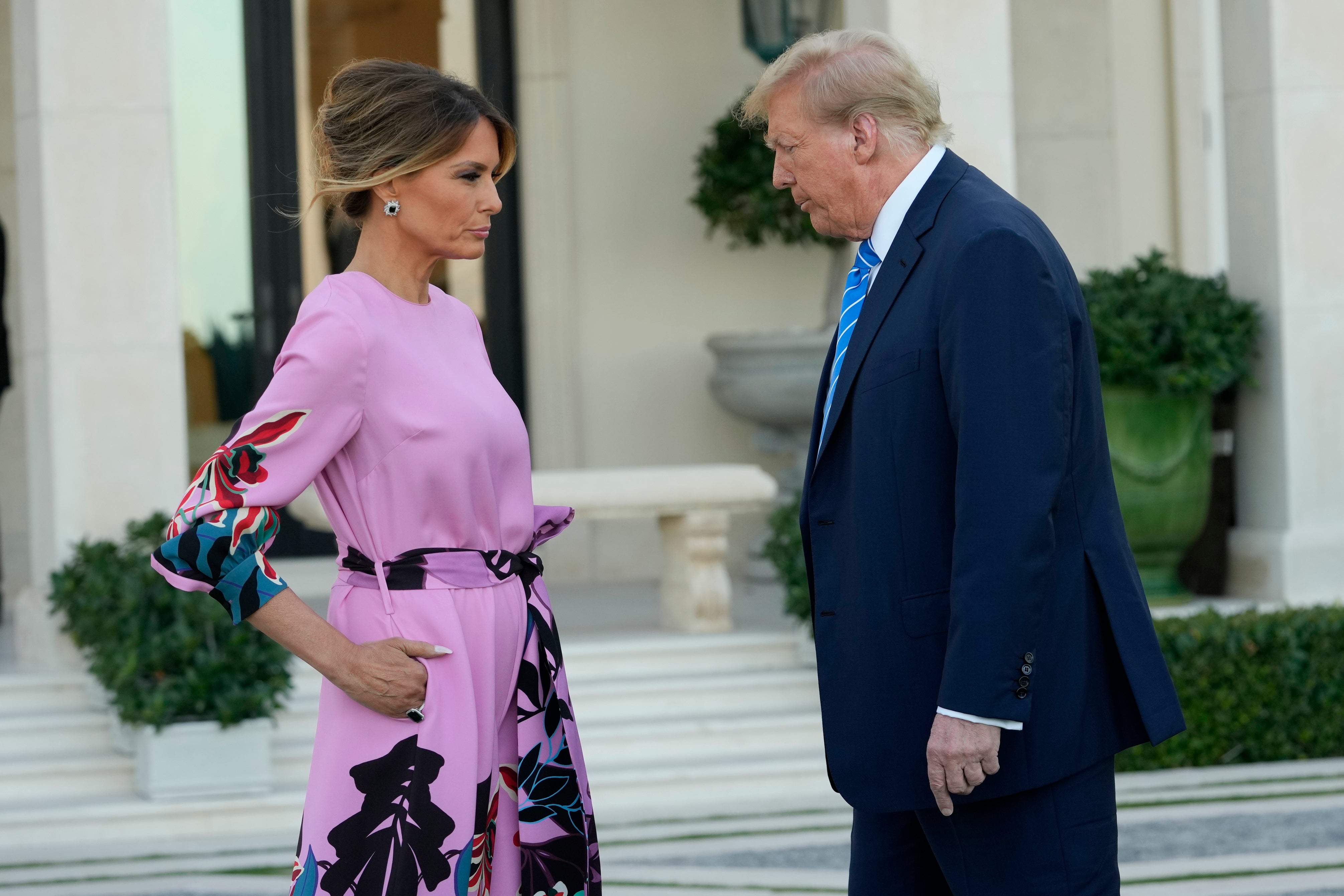 Donald Trump, right, stands with Melania Trump as they arrive for a GOP fundraiser on Saturday in West Palm Beach