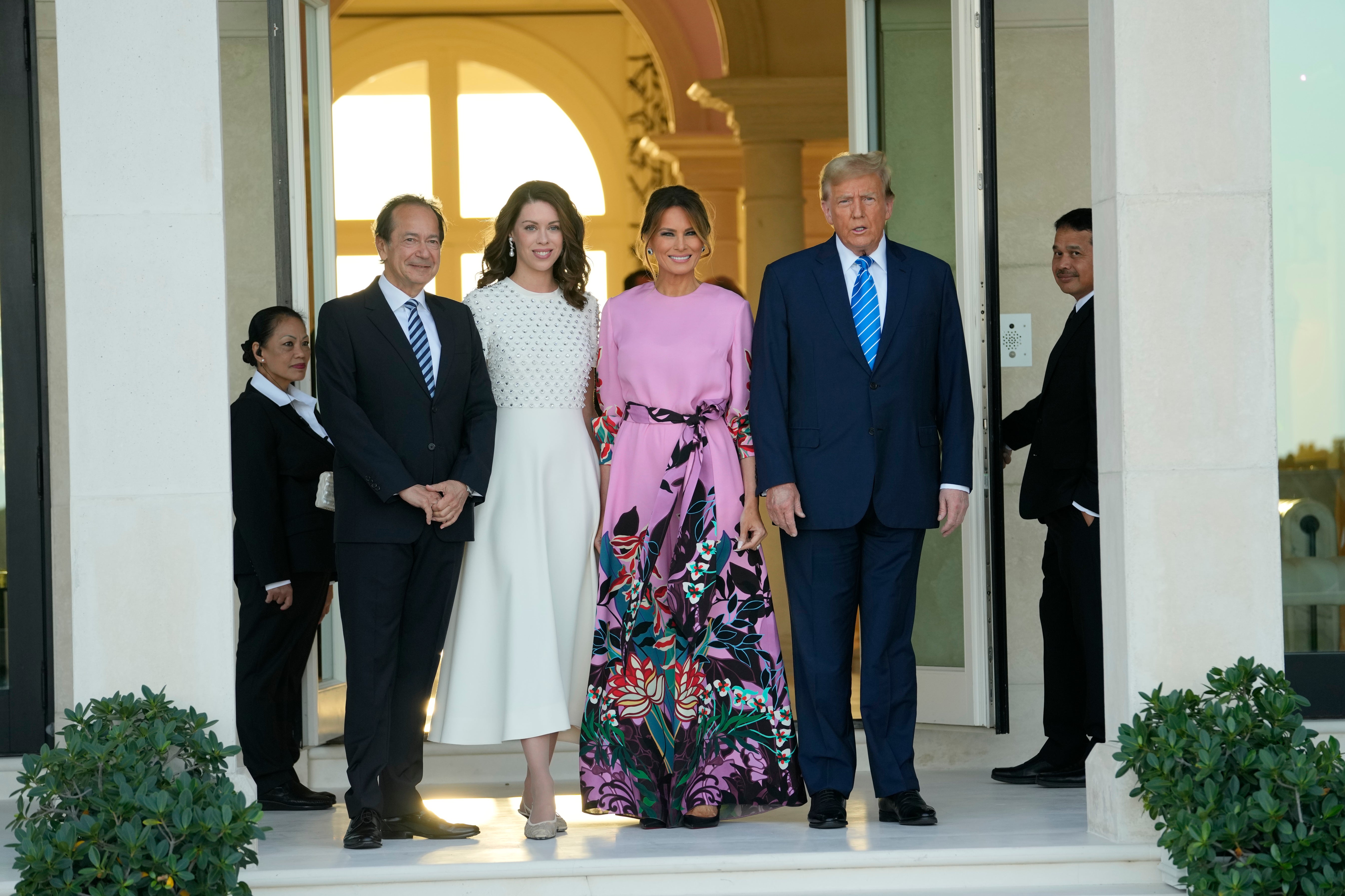 From left, John Paulson, Alina de Almeida, Melania Trump, and Donald Trump gather for a fundraiser at Paulson’s Palm Beach home on 6 April, 2024