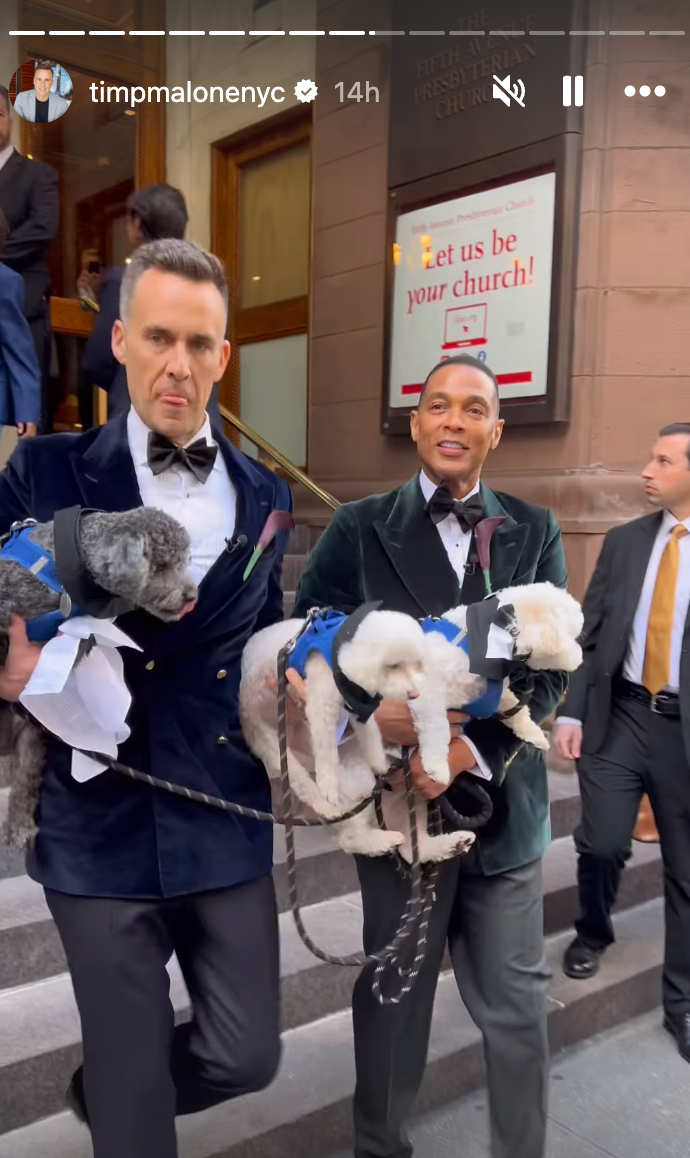 Tim Malone and Don Lemon holding their dogs as they exit the church