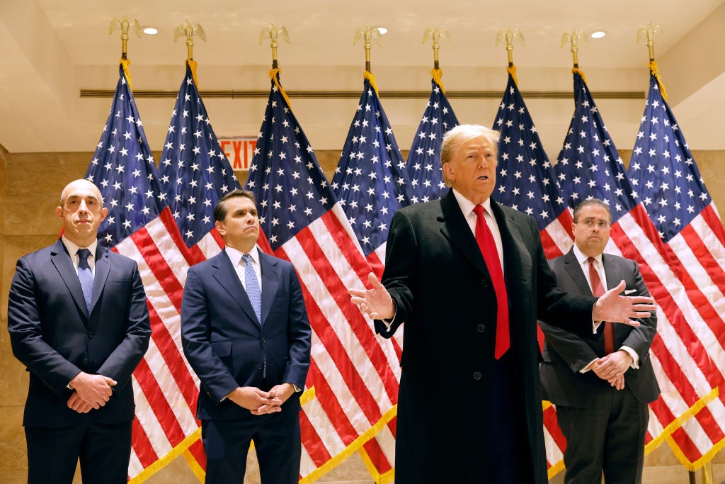 <p>Donald Trump speaks to the media after his court appearance in his hush money case in Manhattan on 25 March</p>
