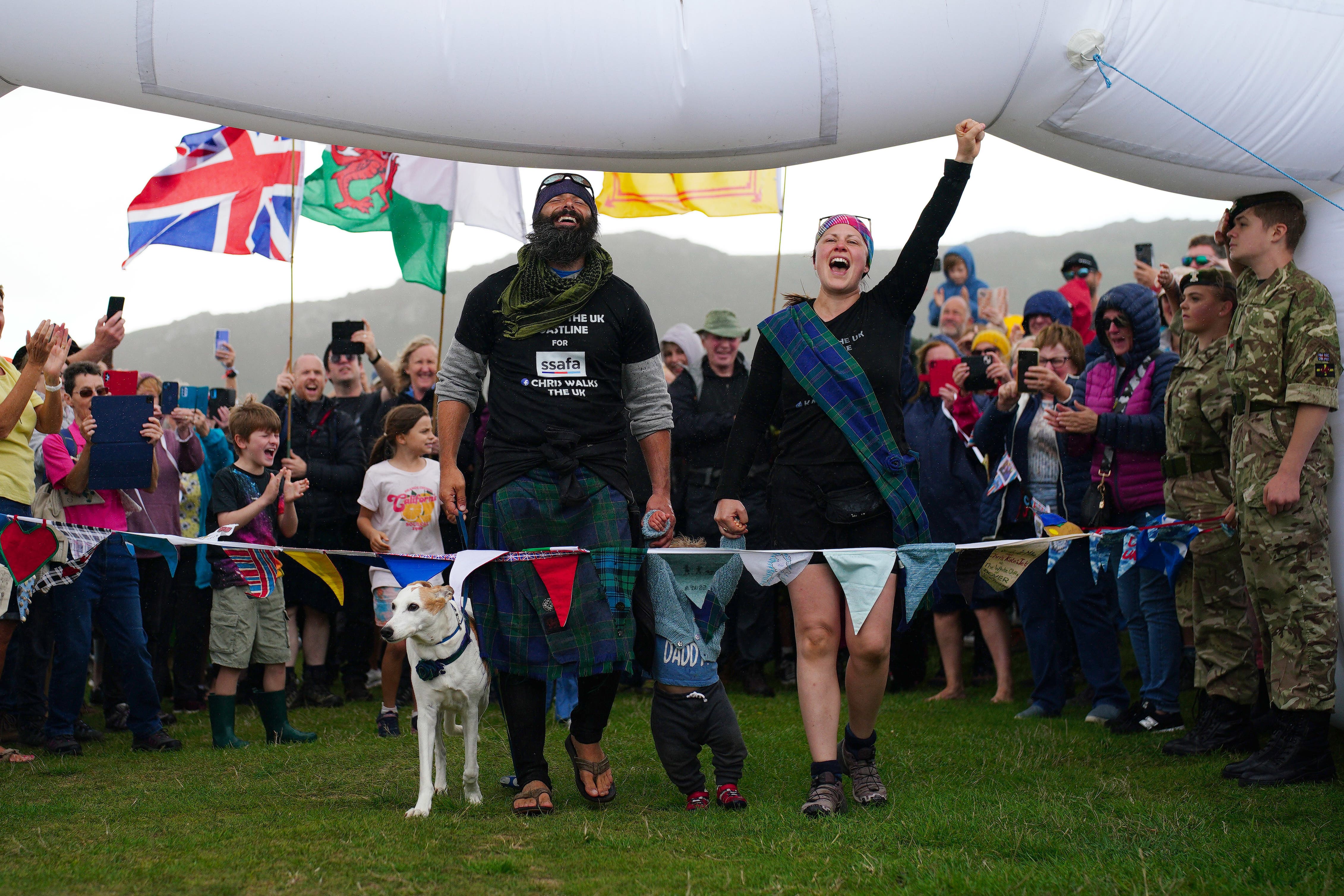 Chris Lewis with partner Kate Barron and their son Magnus (Ben Birchall/PA)