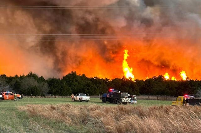 <p>File image: Firefighters and emergency responders at scene of wildfire in Woodward County, Oklahoma. Scientists say March has become 10th straight month to break temperature records </p>