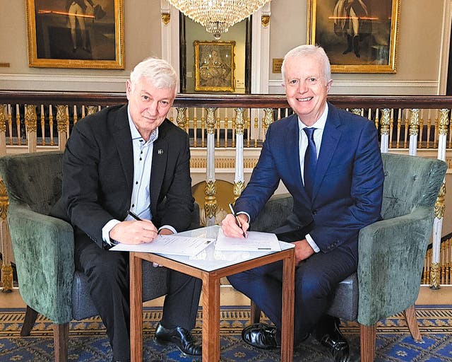 <p>Jonathan Geldart (left) and Andrew Seaton, CEO of the China-Britain Business Council, sign a memorandum of understanding between the CBBC and the Institute of Directors in London</p>
