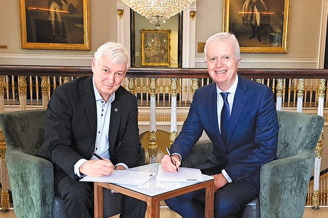 <p>Jonathan Geldart (left) and Andrew Seaton, CEO of the China-Britain Business Council, sign a memorandum of understanding between the CBBC and the Institute of Directors in London</p>
