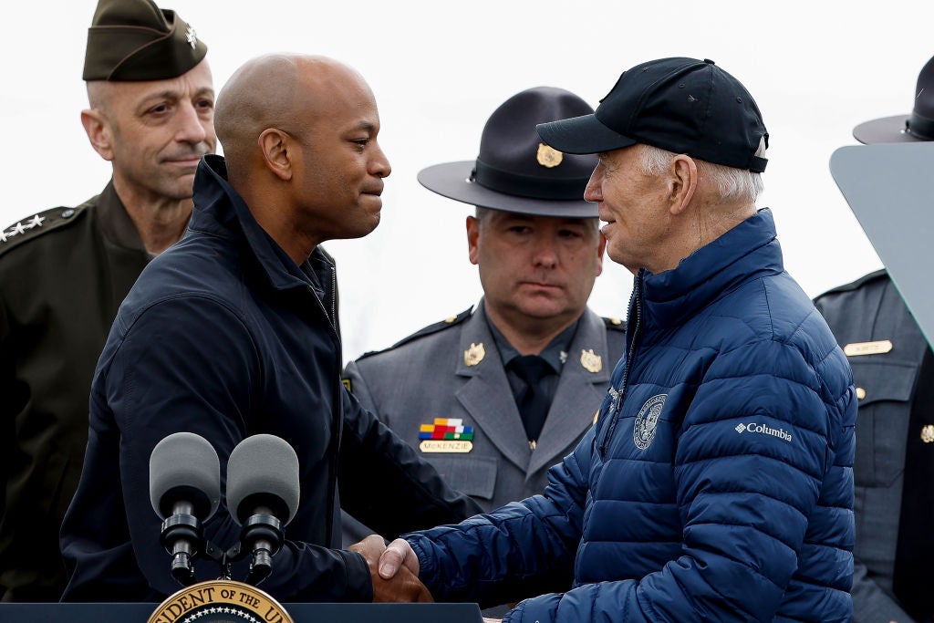 Maryland Governor Wes Moore shakes hands with President Joe Biden as they visit the site of the Key Bridge collapse on 5 April