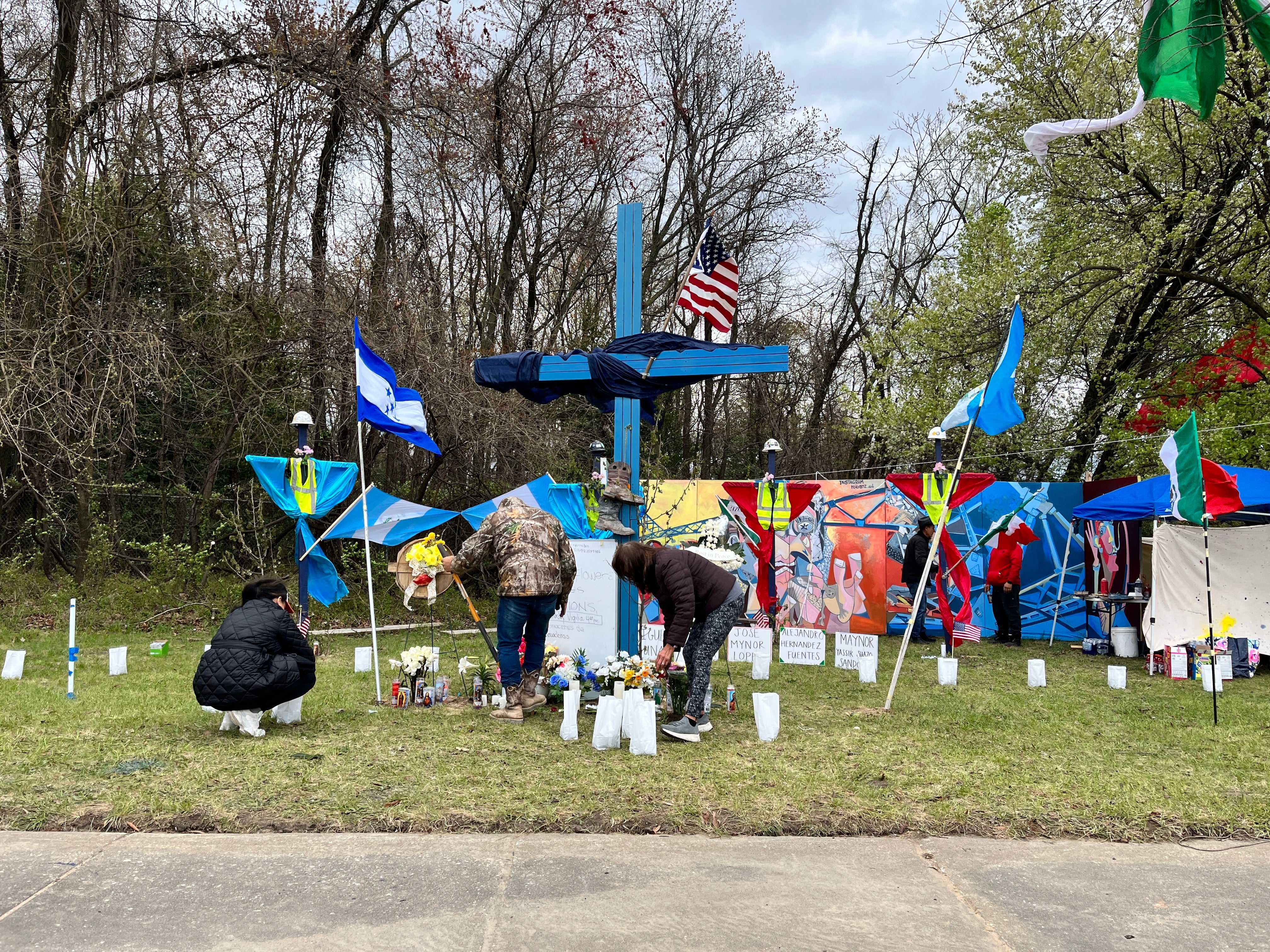 Baltimore locals working on a memorial left for the six victims of the Francis Scott Key Bridge collapse - Maynor Yasir Suazo-Sandoval, 38; Alejandro Hernandez Fuentes, 35; 26-year-old Dorlian Ronial Castillo Cabrera; Jose Mynor Lopez, 35; Miguel Luna, 49, and one who had not been identified
