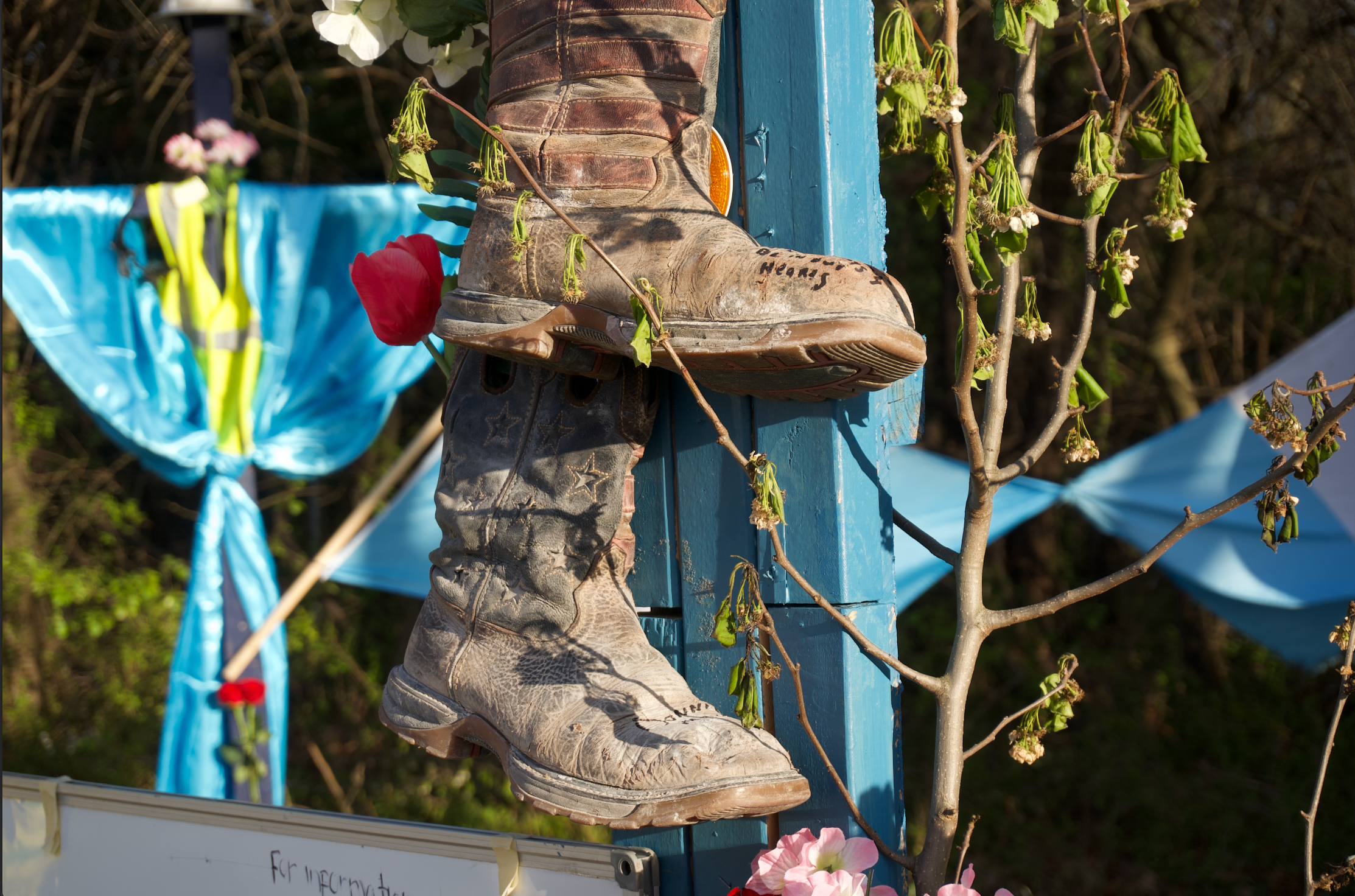 Boots placed on one of the crosses at the memorial honouring the victims of the Francis Scott Key Bridge Collapse.