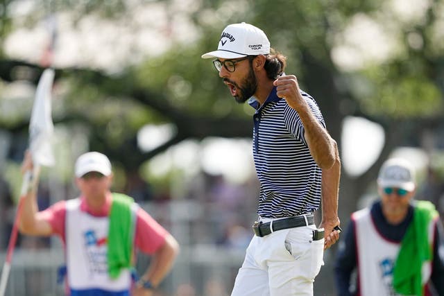 Akshay Bhatia reacts to his birdie putt on the 18th hole (Eric Gay/AP)