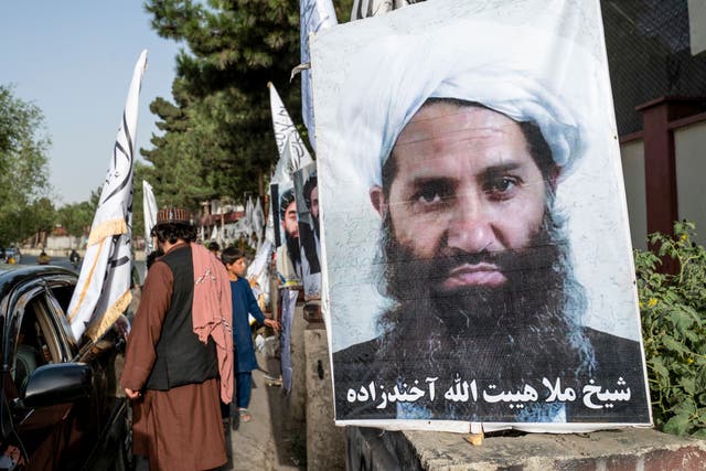 <p>A roadside poster of Taliban Supreme Leader Hibatullah Akhundzada in Kabul in August 2023 </p>