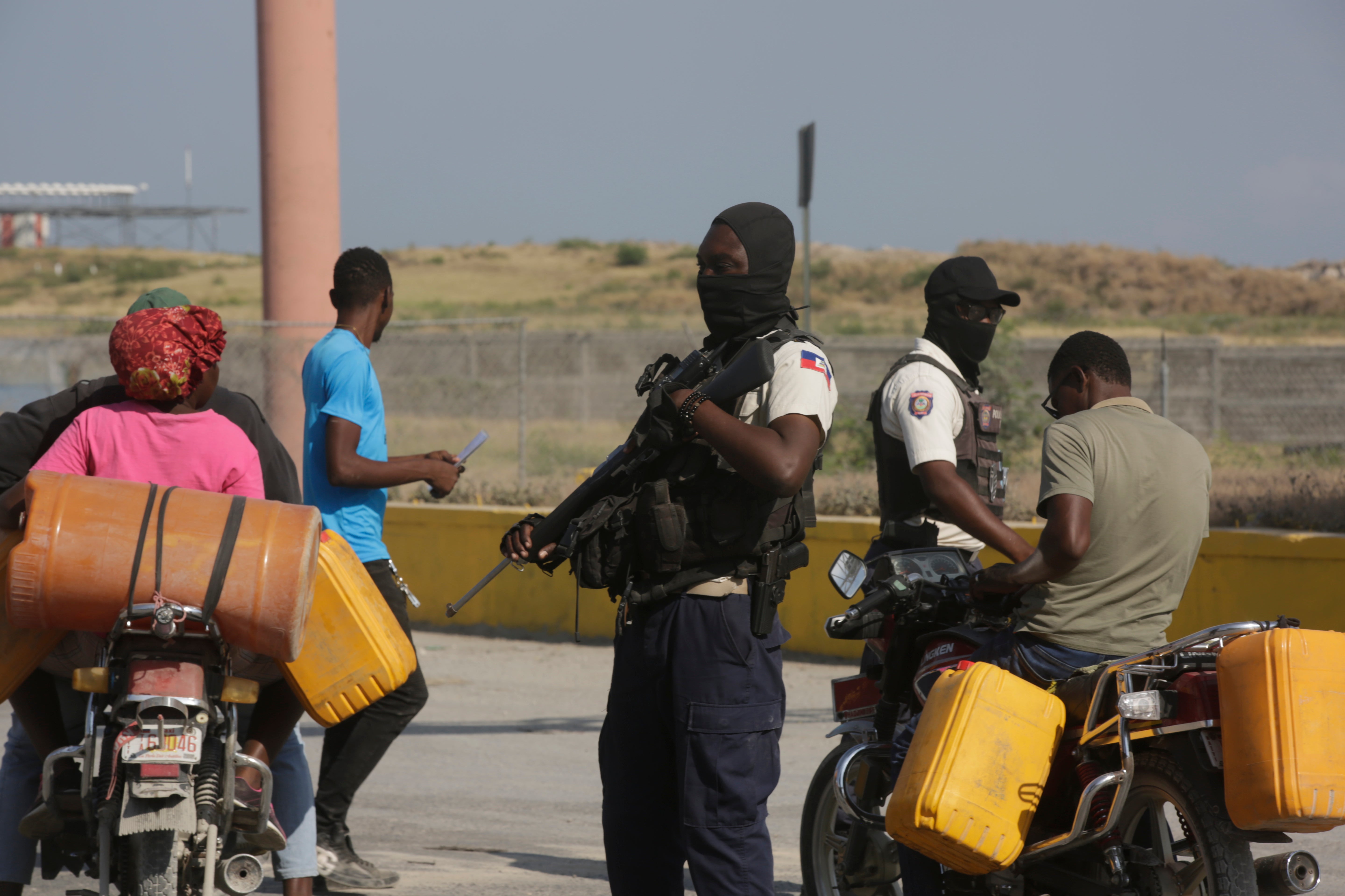 A National Police officer patrols an intersection in Port-au-Prince, Haiti