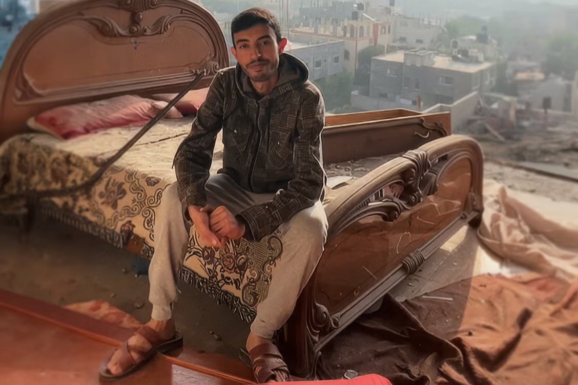 Ahmad Ghunaim in his ‘bedroom’ in Gaza after the bombing