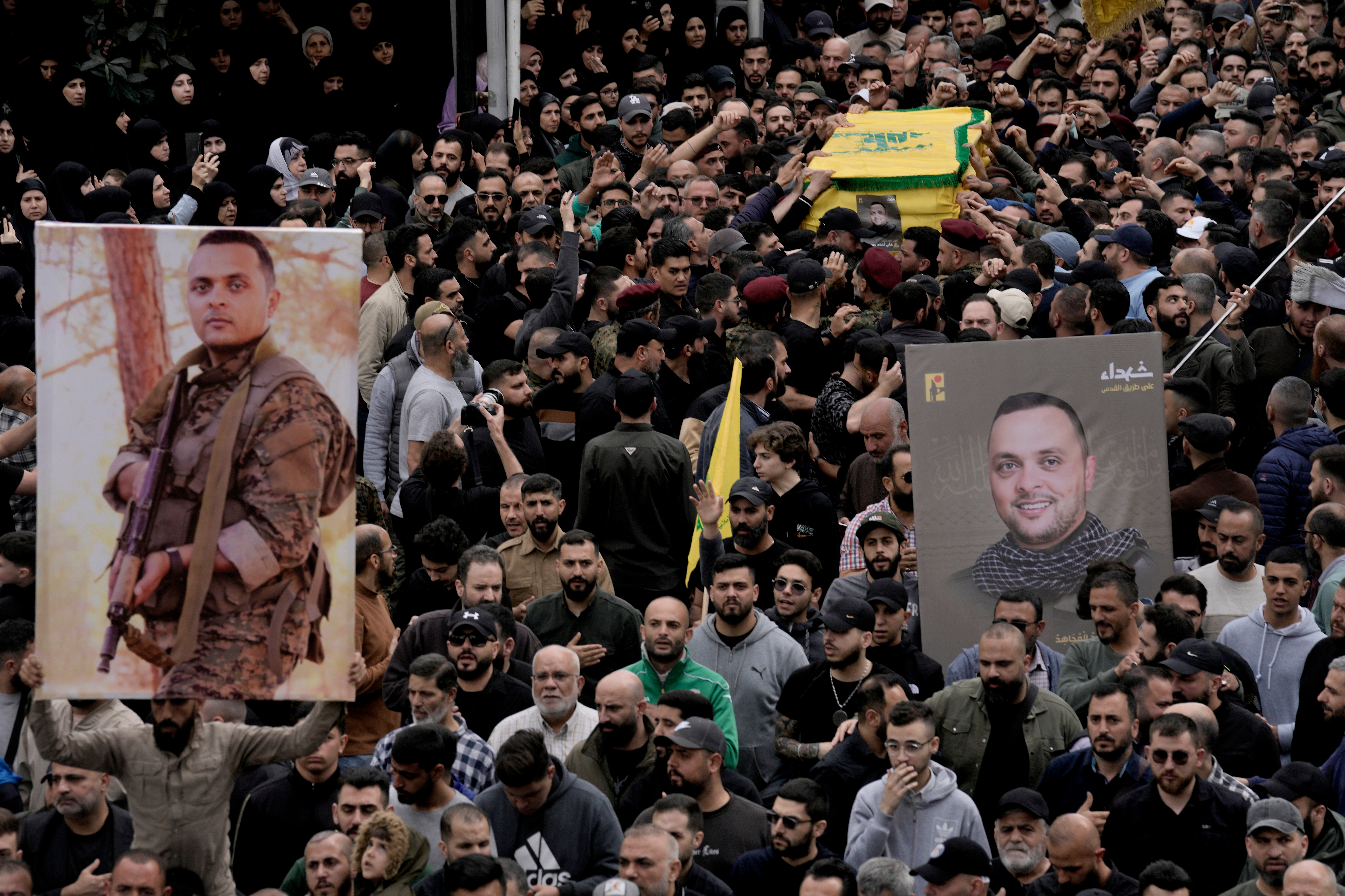 Hezbollah fighters carry the coffin of Ali Ahmad Hussein, who was killed by an Israeli strike in south Lebanon