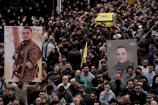 <p>Hezbollah fighters carry the coffin of Ali Ahmad Hussein, who was killed by an Israeli strike in south Lebanon </p>
