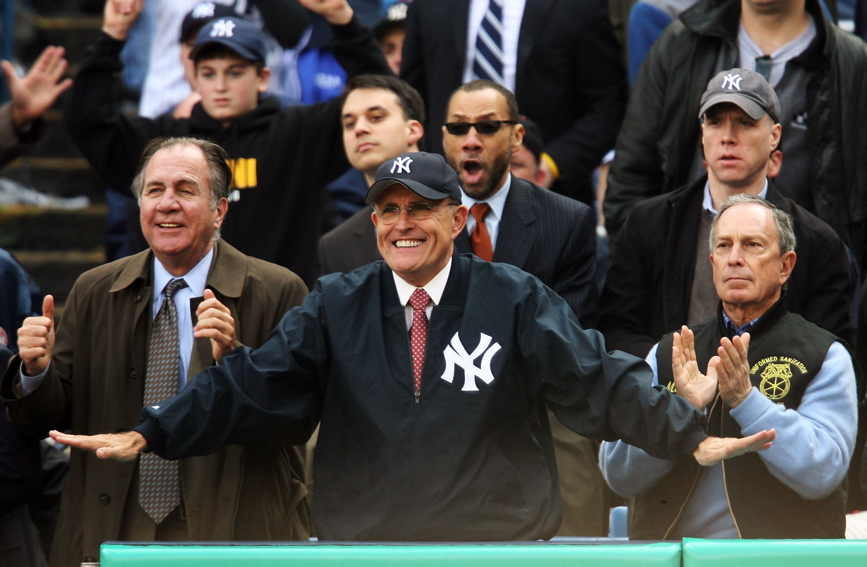 Former New York City Mayor Rudolph Giuliani and then-mayor Michael Bloomberg watch the New York Yankees play the Tampa Bay Devil Rays during their Opening Day game at Yankee Stadium April 2, 2007. Giuliani now faces a litany of legal and financial issues.