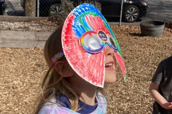 Céleste Early-Mahiet watches the partial solar eclipse from Providence, Rhode Island, on 8 April, 2024
