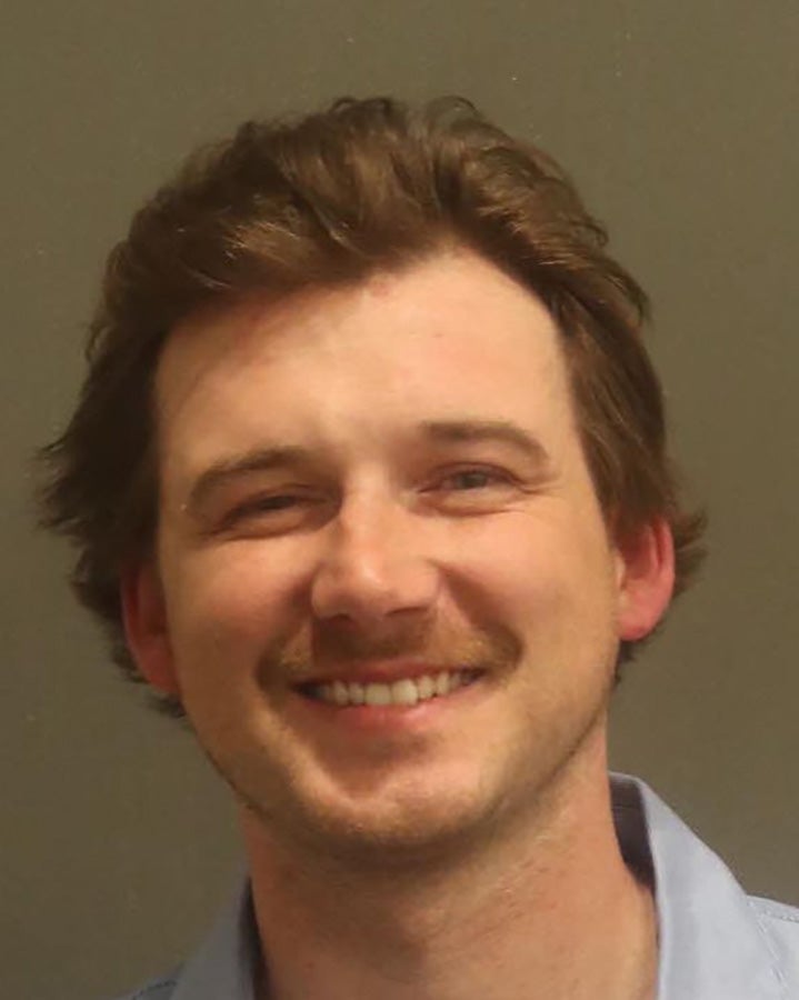 Morgan Wallen poses in a booking photo after being charged with disorderly conduct and three counts of reckless endangerment