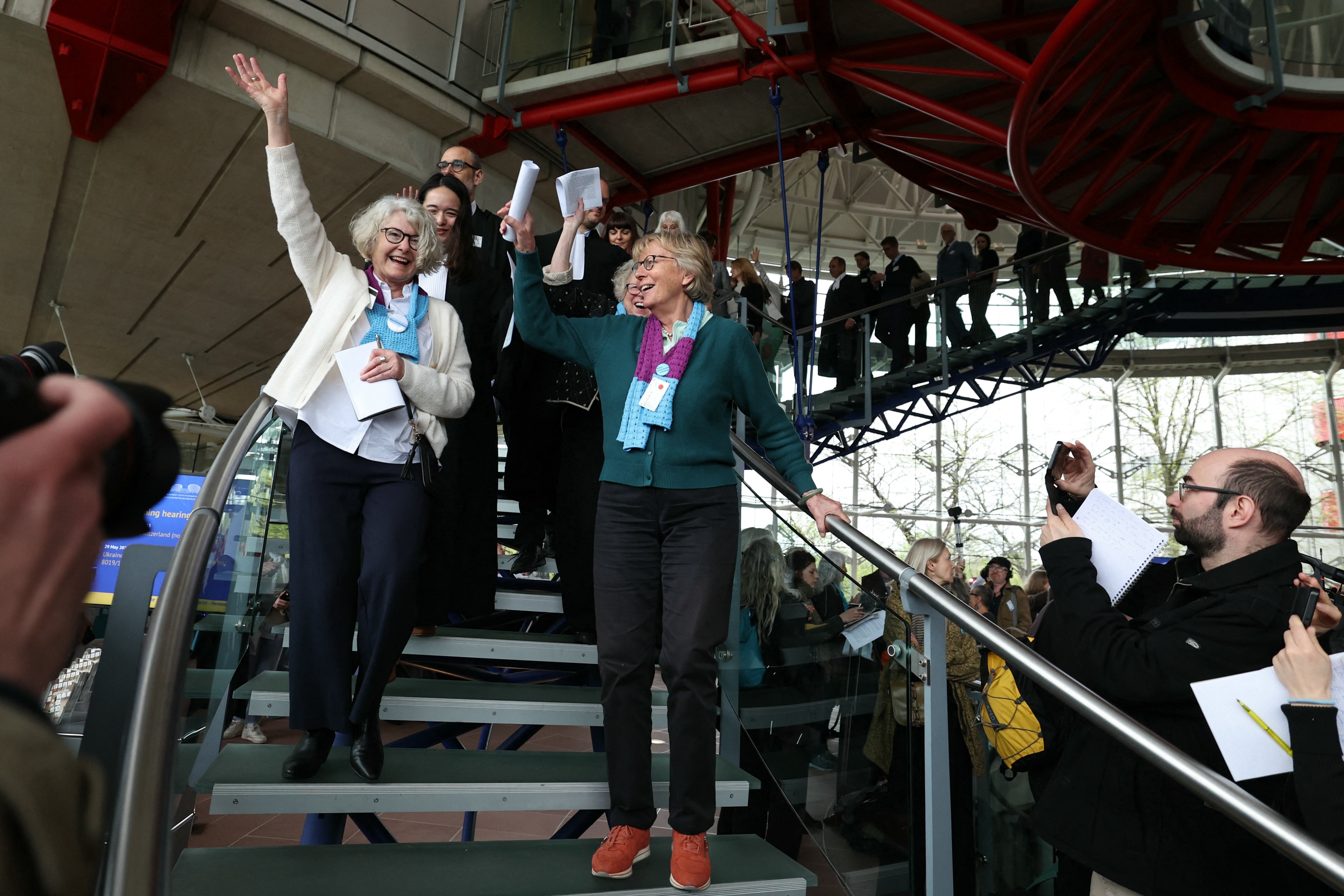 Members of Swiss association Senior Women for Climate Protection react after the ruling