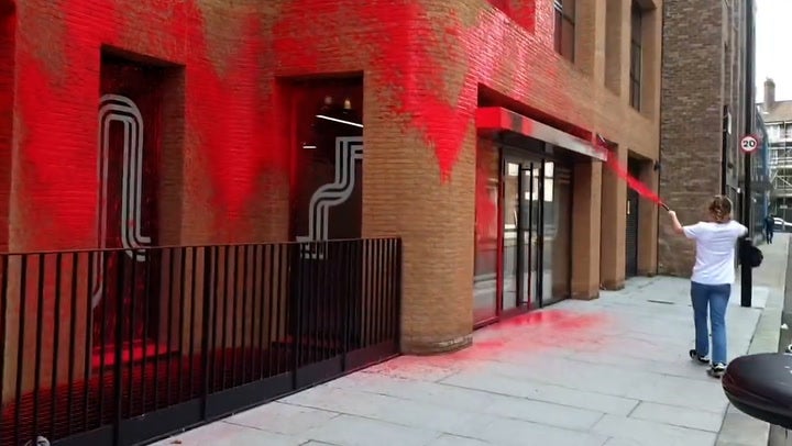 <p>Watch moment protesters spray red paint over Labour headquarters</p>