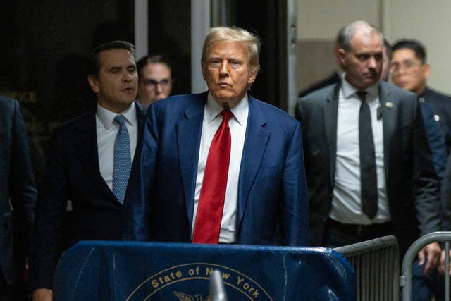 <p>Donald Trump speaks to the media after a pre-trial hearing on 25 March in New York City</p>