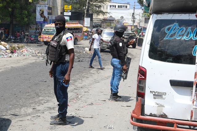 <p>National Police patrol an intersection amid gang violence in Port-au-Prince, Haiti</p>