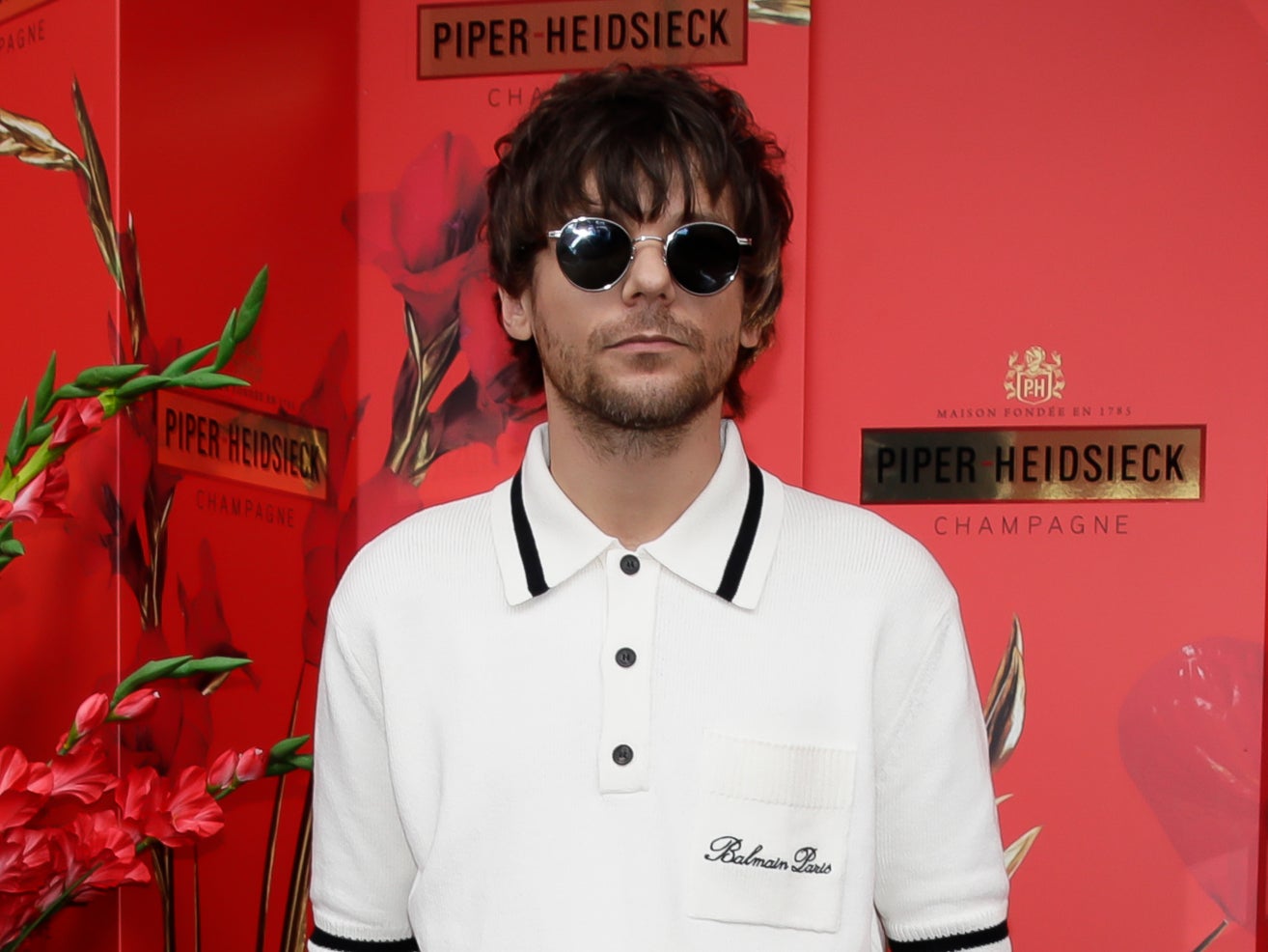 <p> Louis Tomlinson at Piper Heidsieck during the Australian Open</p>