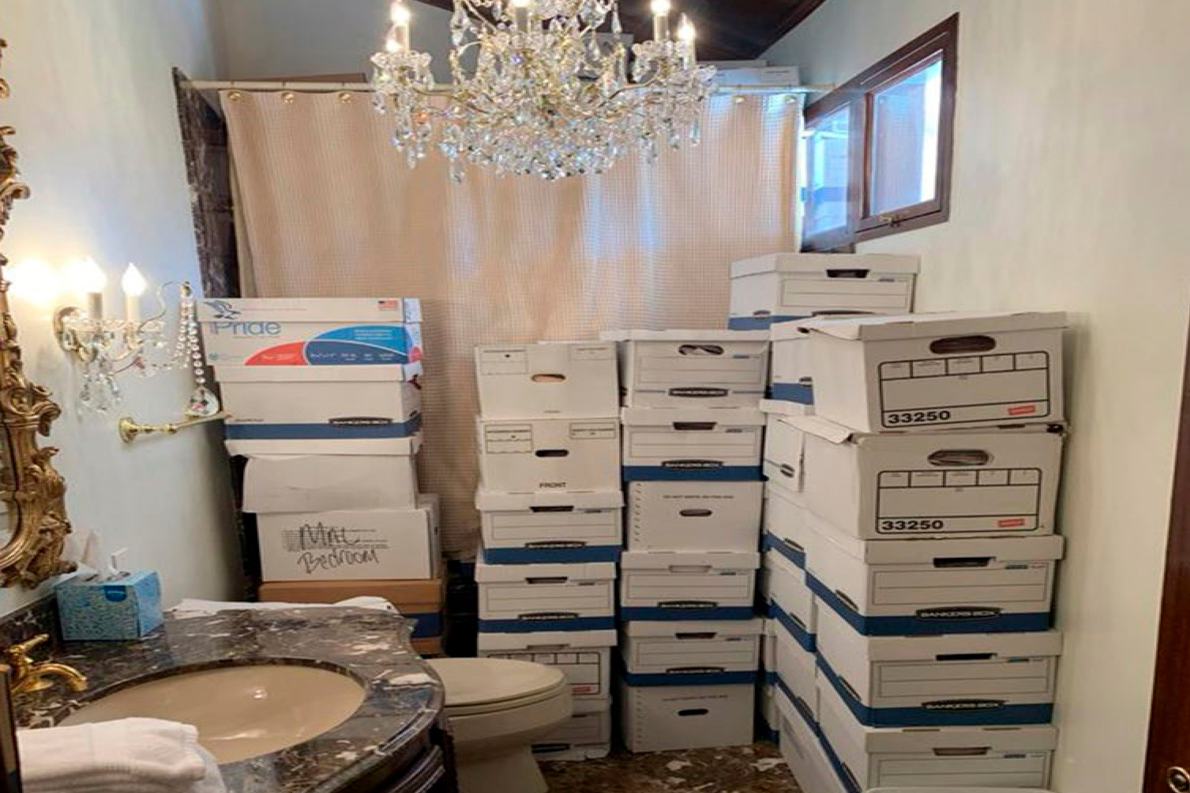 Boxes of records stored in a bathroom and shower in the Lake Room at Trump's Mar-a-Lago estate in Palm Beach, Florida