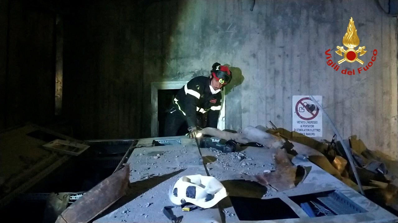 A firefighter works at the site after a blast at a hydroelectric power plant in Bargi, Italy