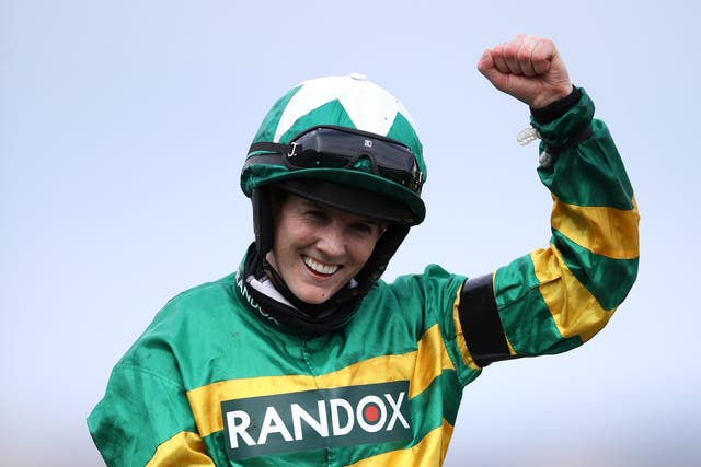 Rachael Blackmore celebrates on Minella Times after winning the 2021 Randox Grand National (Tim Goode/PA)